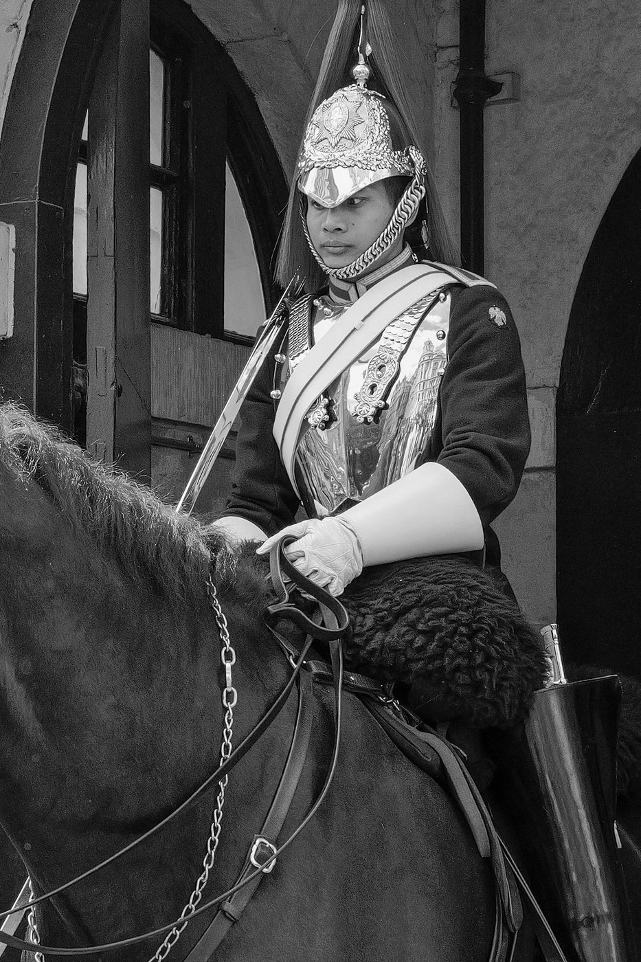 Royal guard in ceremonial dress and plumed helmet, mounted on horseback, London