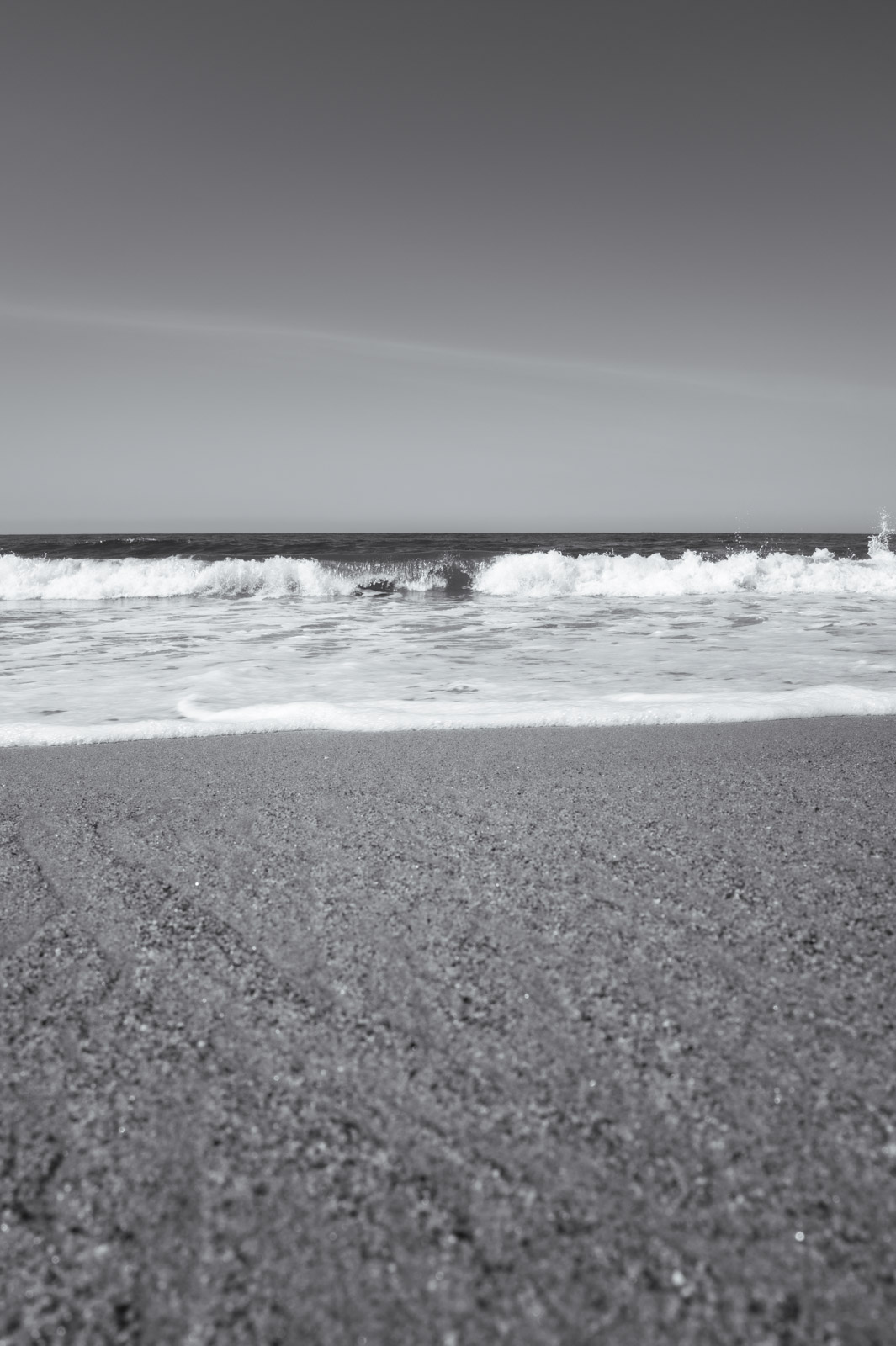 Waves breaking on a sandy beach, Los Angeles