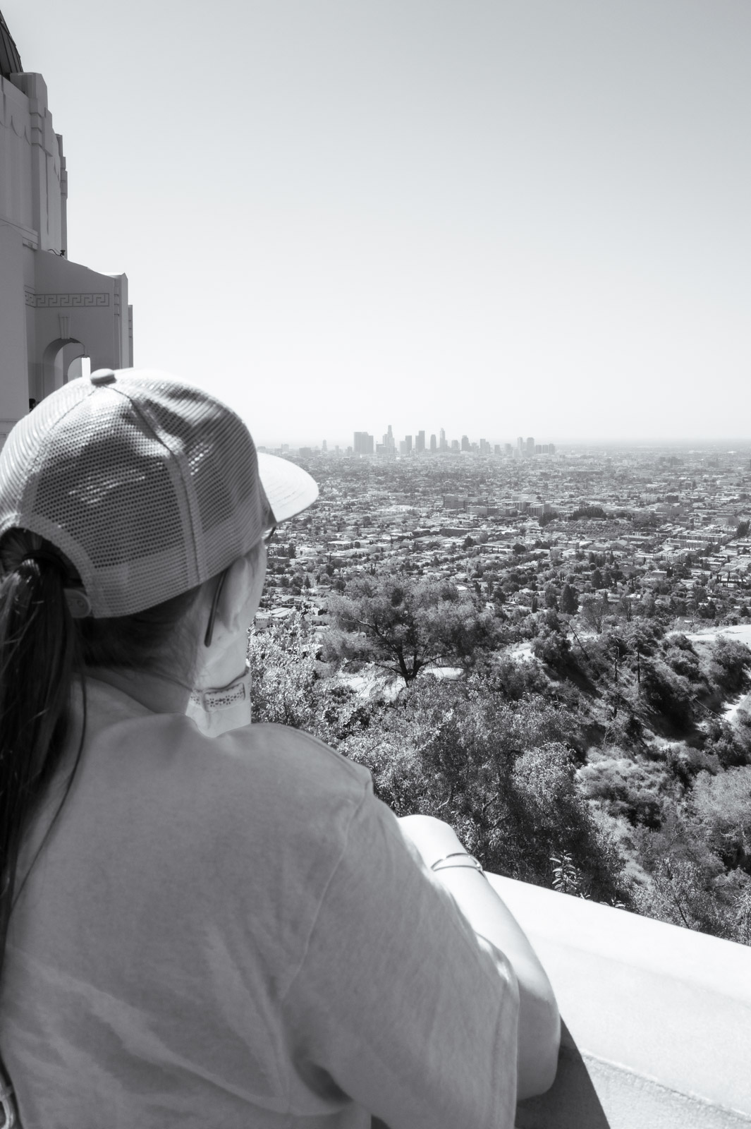 Visitor gazing at the horizon from the Griffith Observatory, Los Angeles