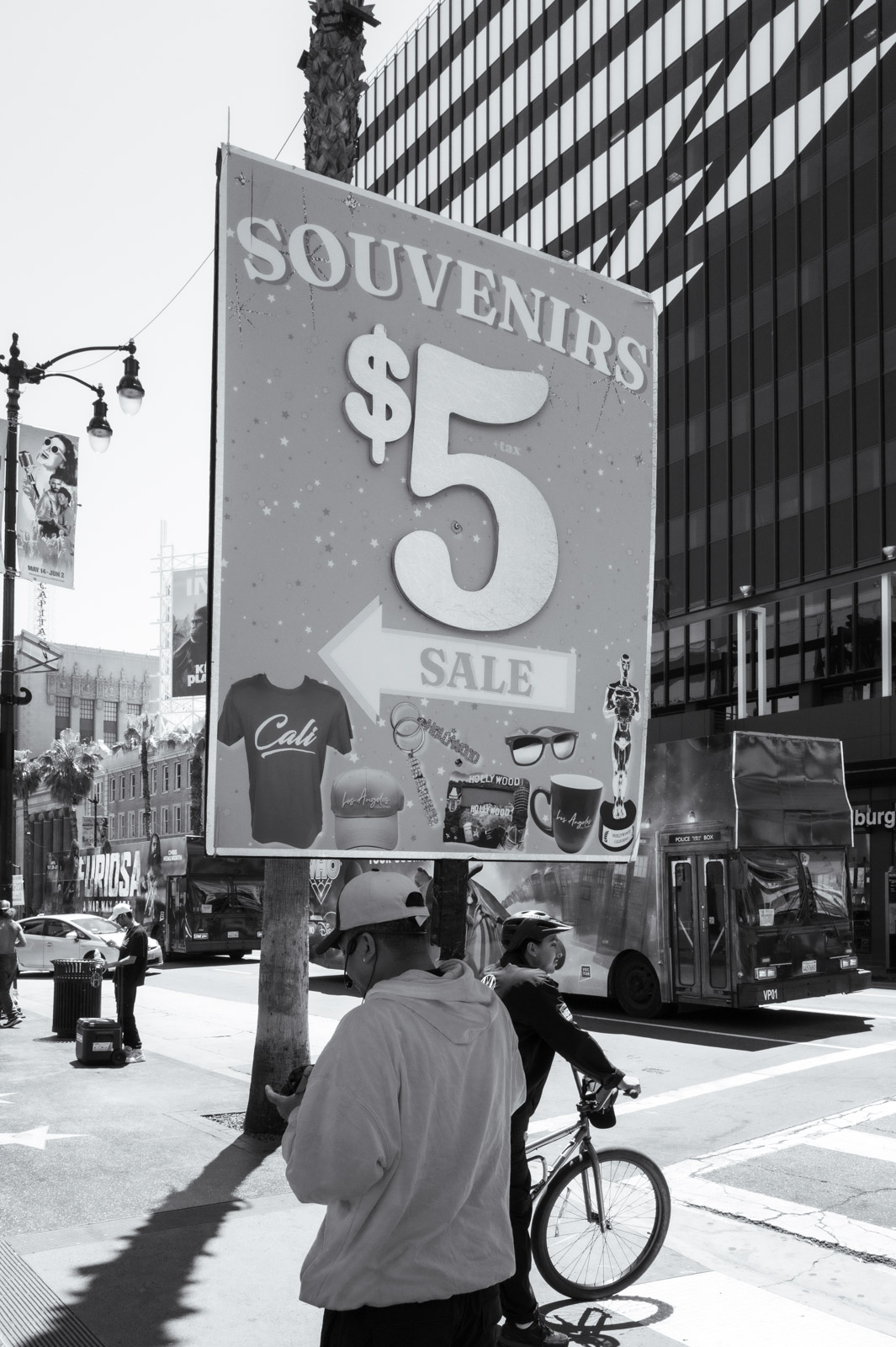“Souvenirs $5” sign on a busy downtown street, Los Angeles