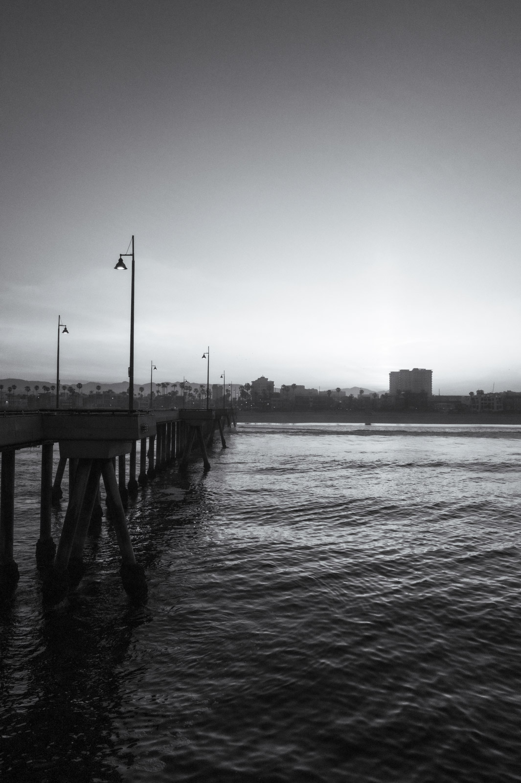 Fishing pier stretching into the ocean at dusk, Los Angeles