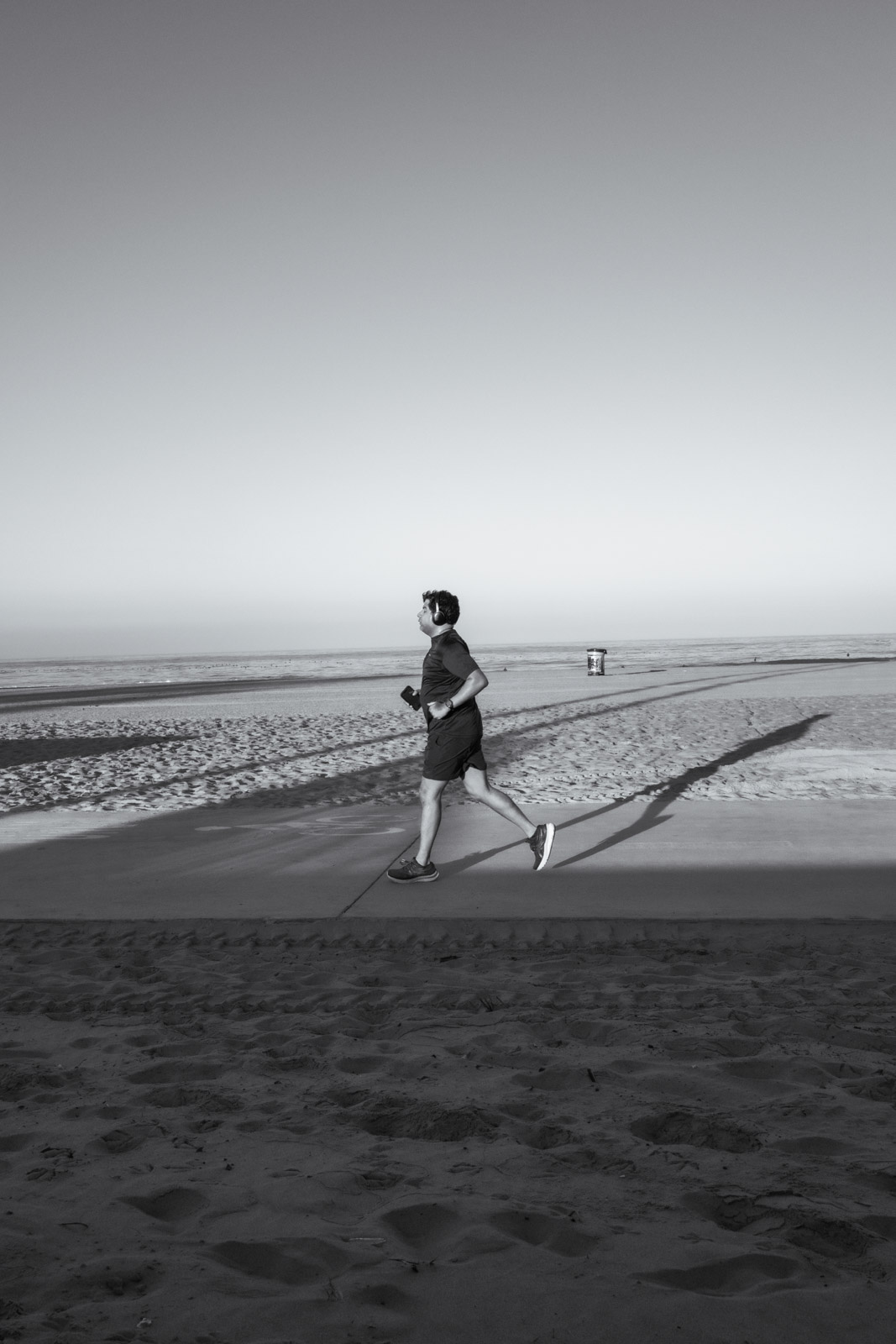 Jogger on the beach at golden hour, Los Angeles