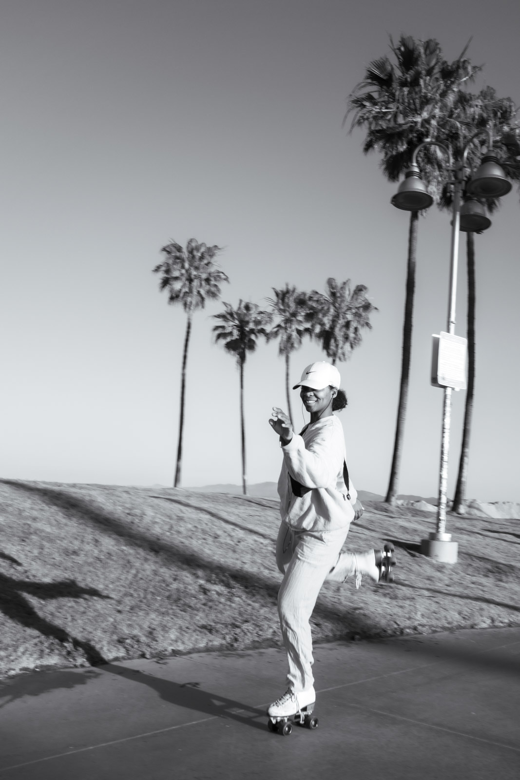 Rollerblader gliding along the boardwalk, Los Angeles