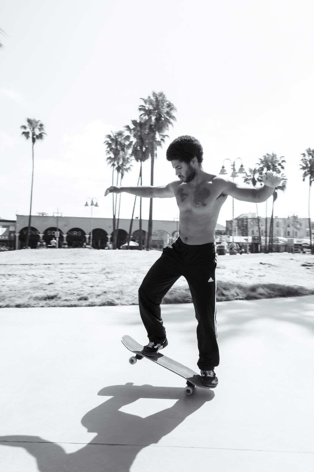 Shirtless skateboarder mid-jump, Los Angeles