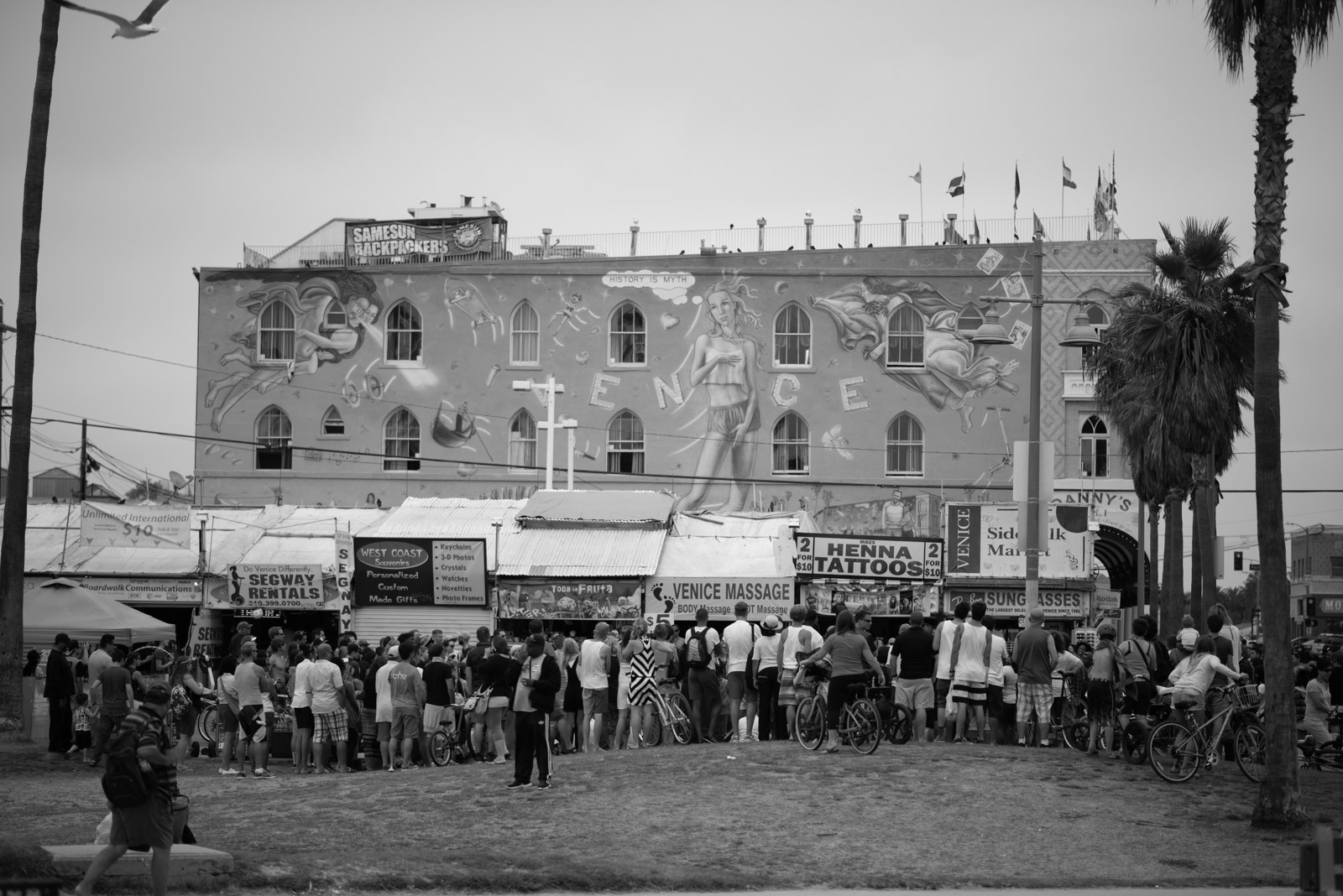 Crowd gathered near an old brick building, Los Angeles