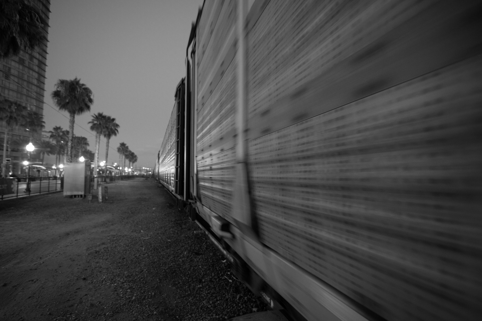 Freight train blurred in motion at dusk, Los Angeles