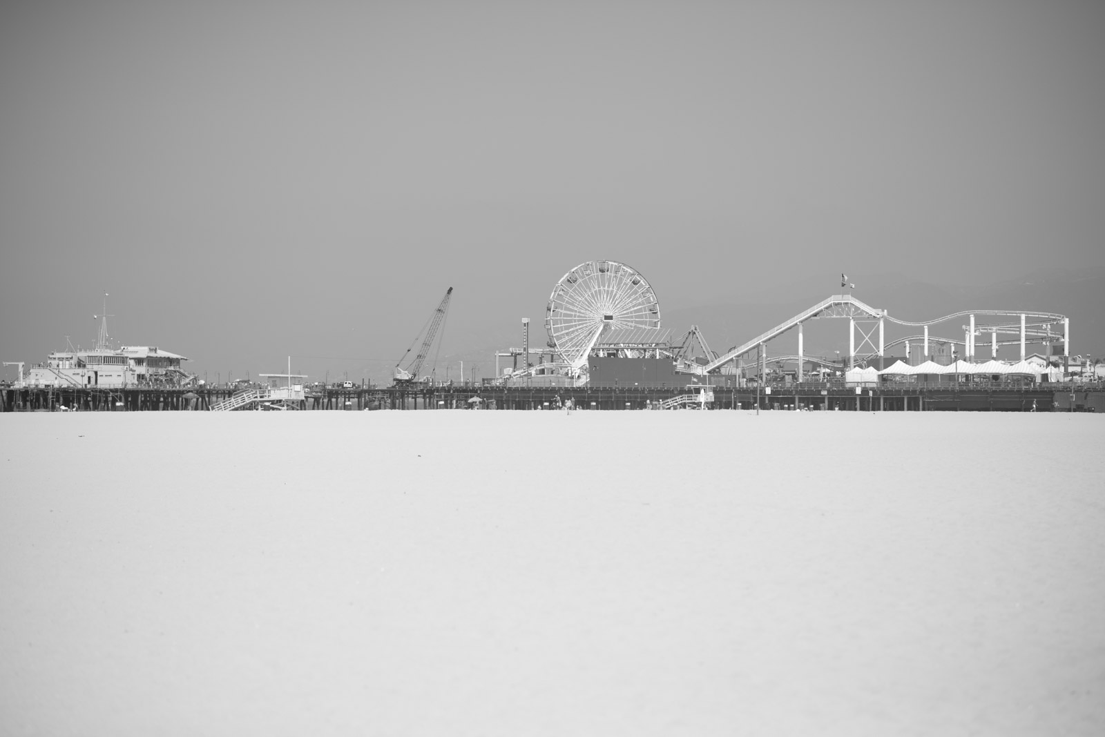 Santa Monica Pier and its ferris wheel seen from the beach, Los Angeles
