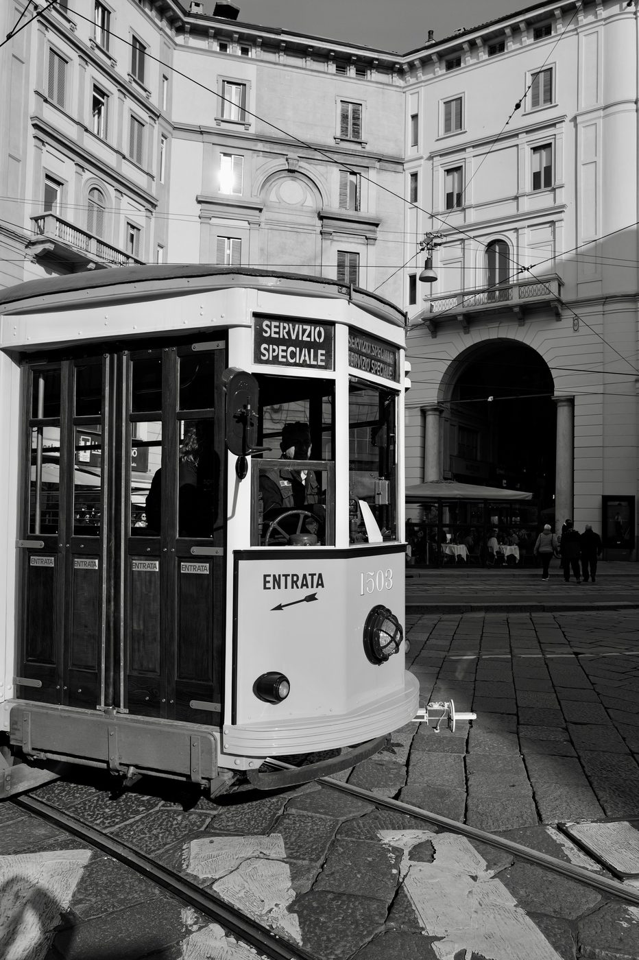 Historic 'Servizio Speciale' tram standing still on a quiet square, Milan