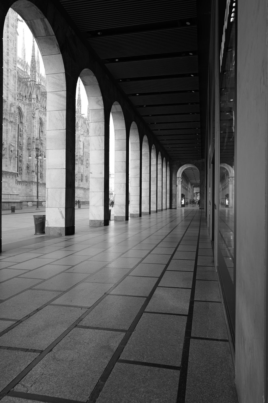 Marble colonnade framing the view of the Duomo's spires, Milan