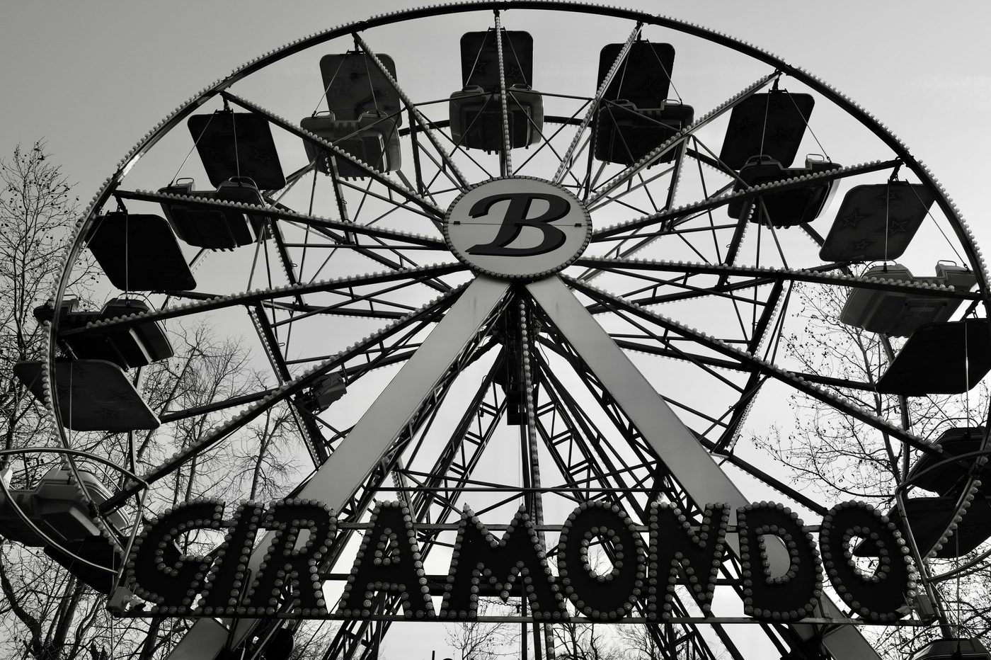 Giramondo Ferris wheel standing out against a clear sky, Milan