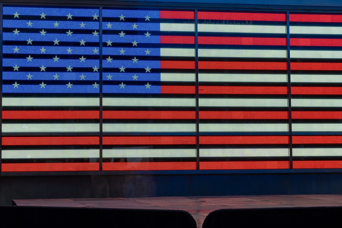 Giant billboard screen displaying an American flag, New York