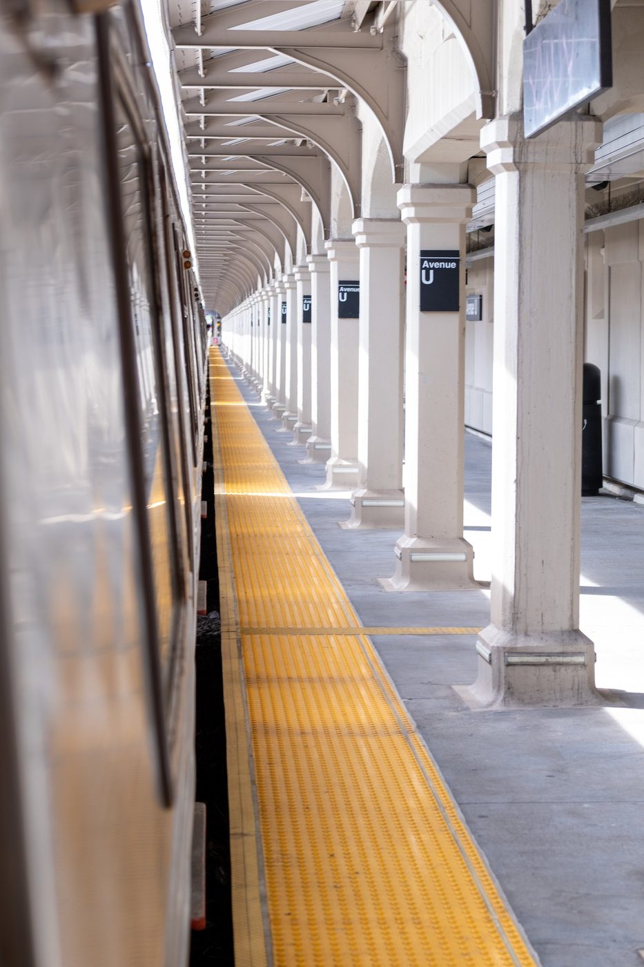 Perspective of colonnades along the elevated platform of Avenue U station, New York