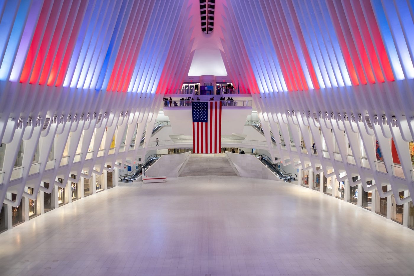 Huge American flag hanging in the Oculus's white hall, New York