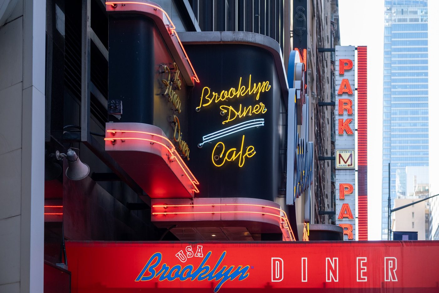 Neon sign of the Brooklyn Diner Cafe on a Manhattan facade, New York