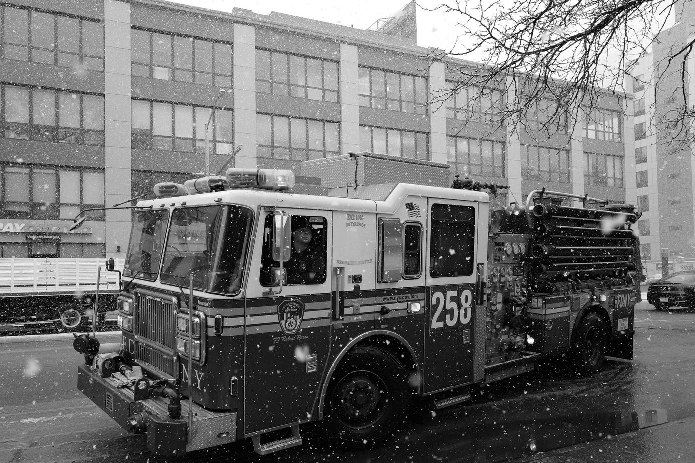 FDNY fire truck driving through the snow, New York