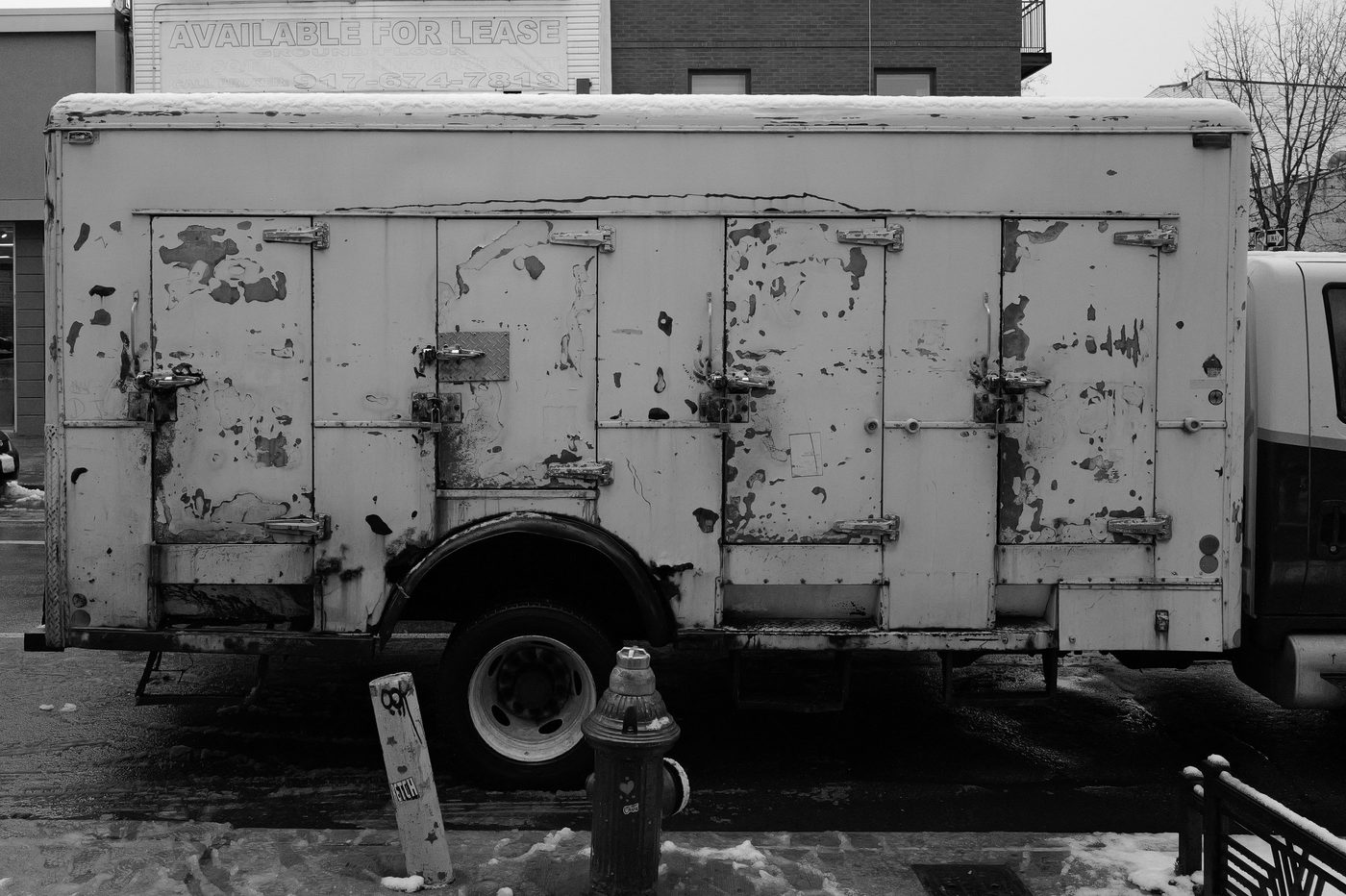 Old rusty truck parked near a fire hydrant, New York
