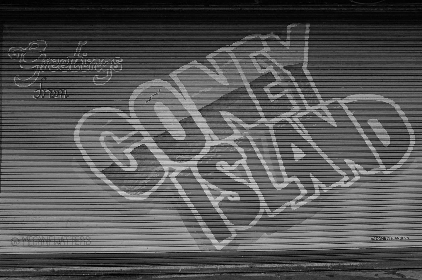 Metal shutter painted with 'Greetings from Coney Island', New York