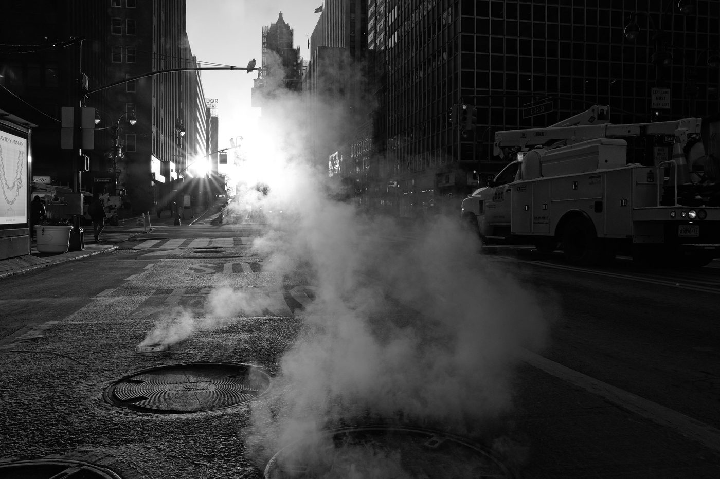 Steam lit up by the low sun on 42nd Street, New York