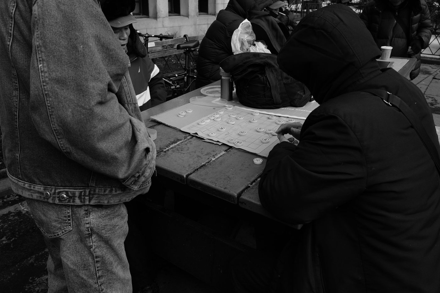 Game of Chinese checkers on a park table, New York