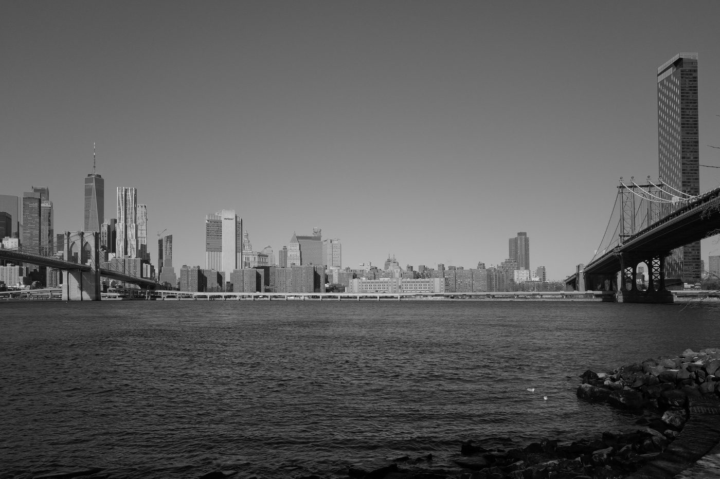 Manhattan skyline framed by two bridges over the water, New York