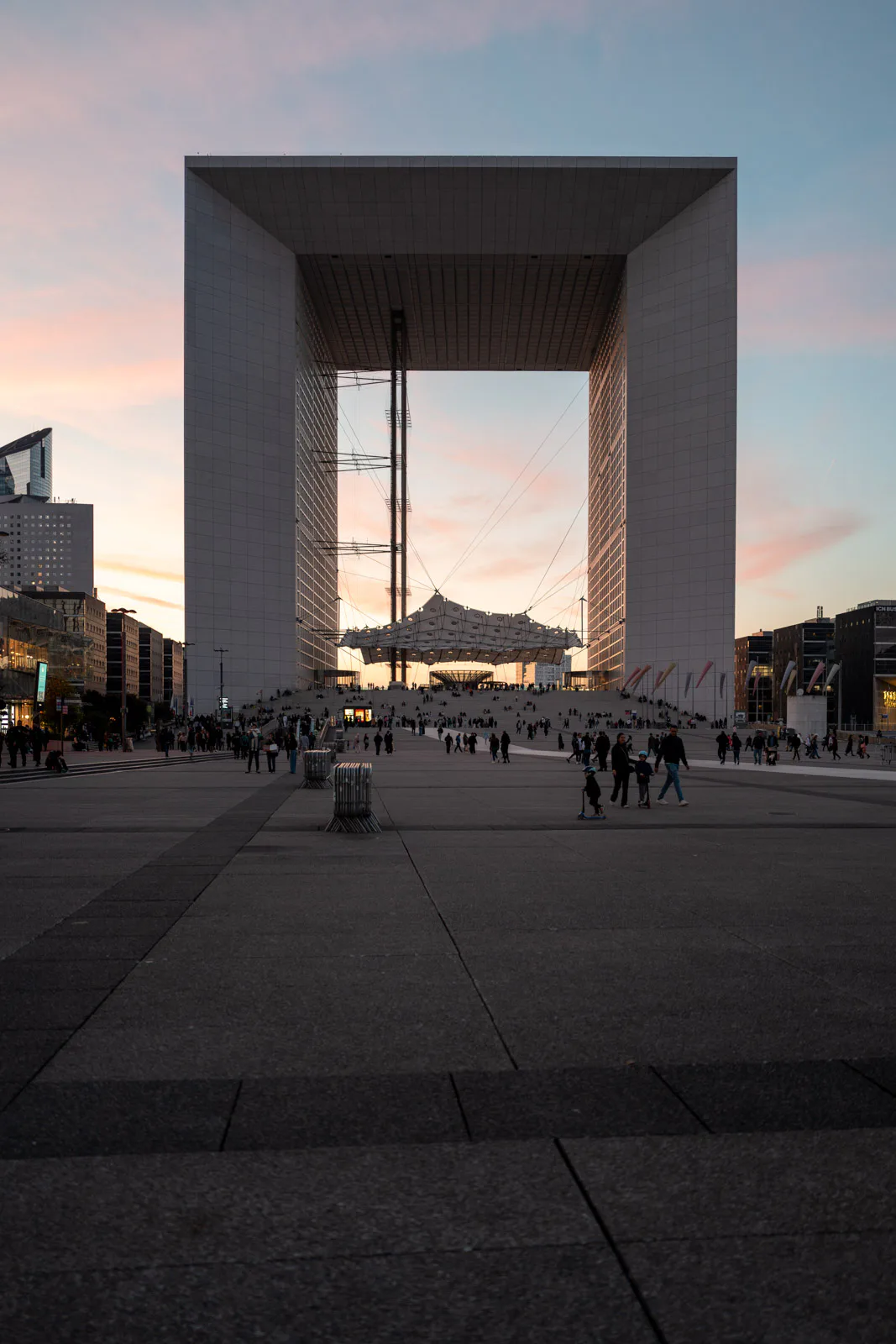 The Grande Arche at sunset, the crowd on the esplanade, Paris