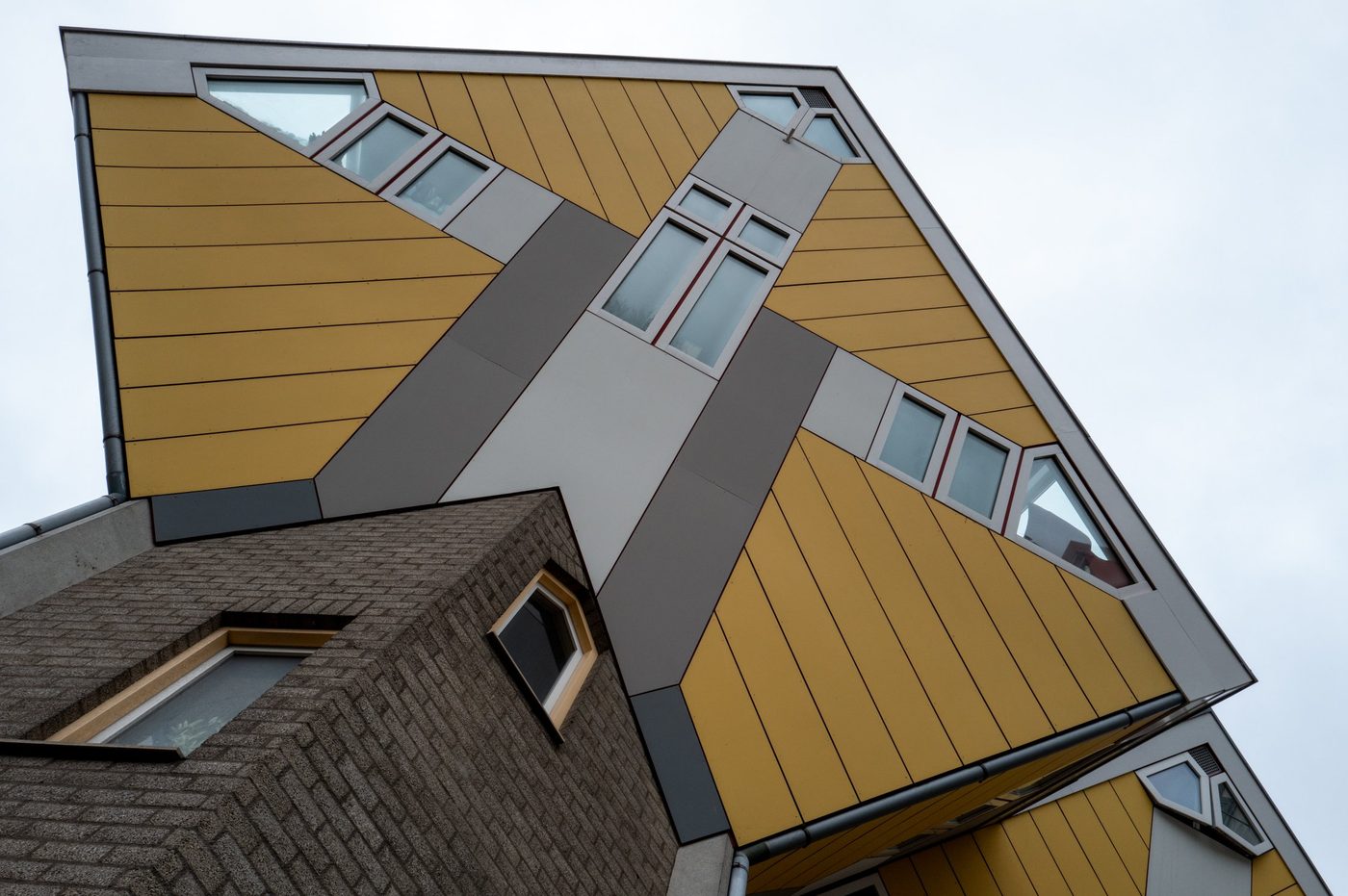 Edge of a cube house forming an X of yellow windows, Rotterdam