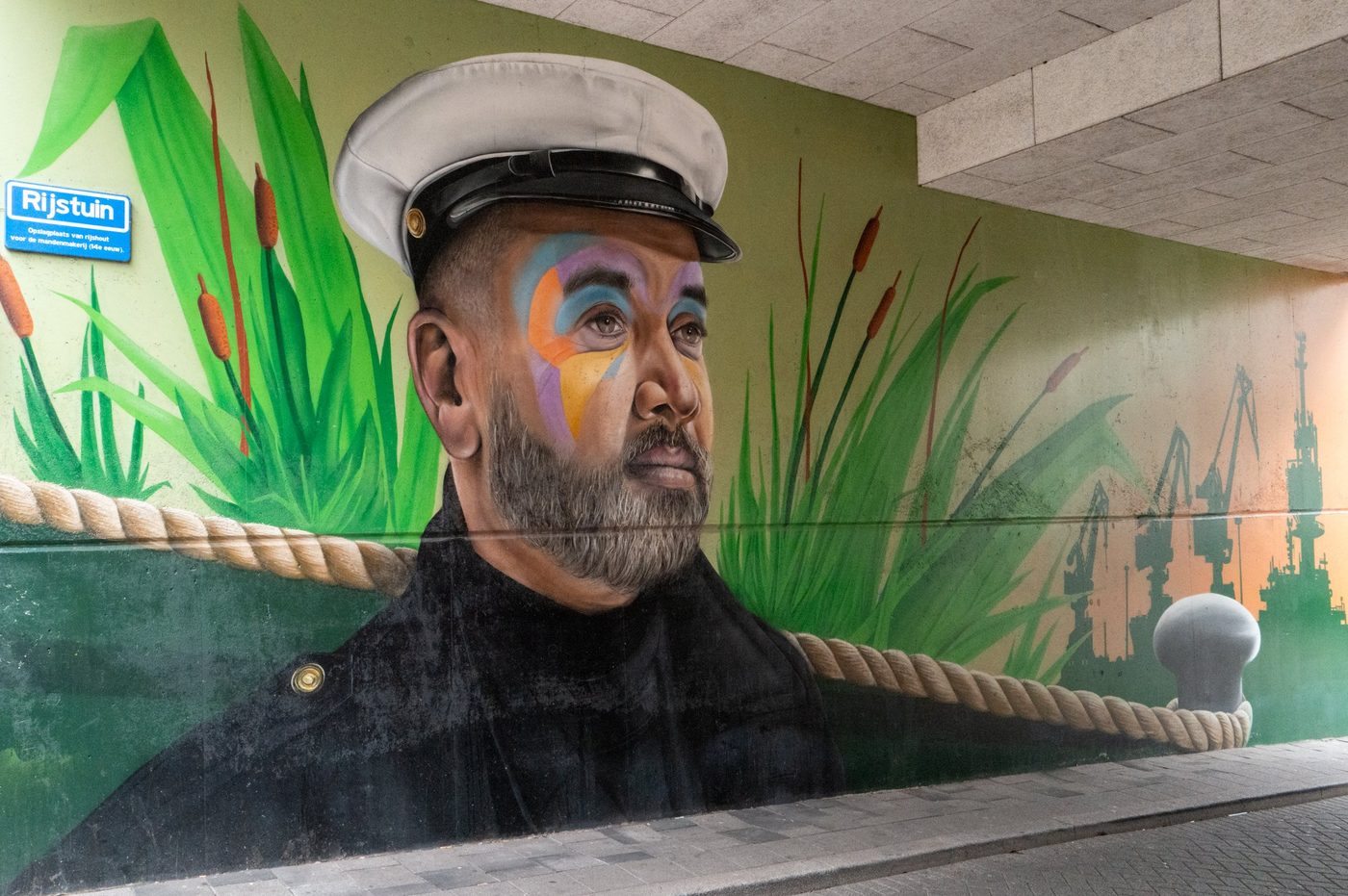 Mural of a sailor with a painted face in an underground passage, Rotterdam