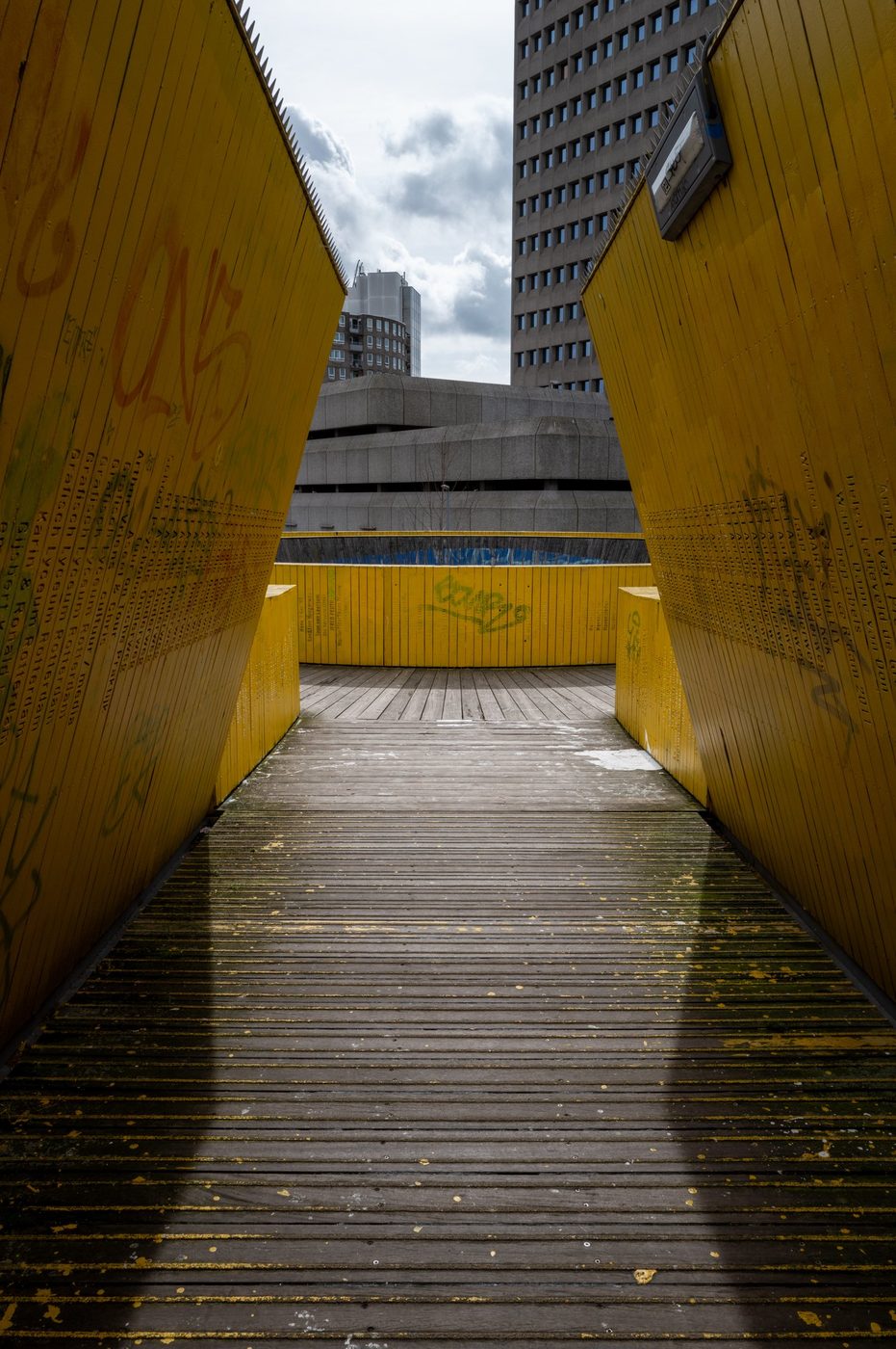 Perspective of the yellow Luchtsingel leading toward the city center towers, Rotterdam
