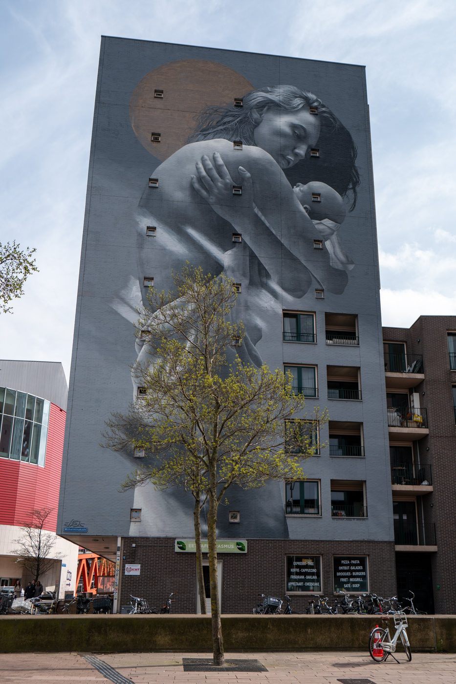 Mural portrait of a mother holding her baby on a building, Rotterdam