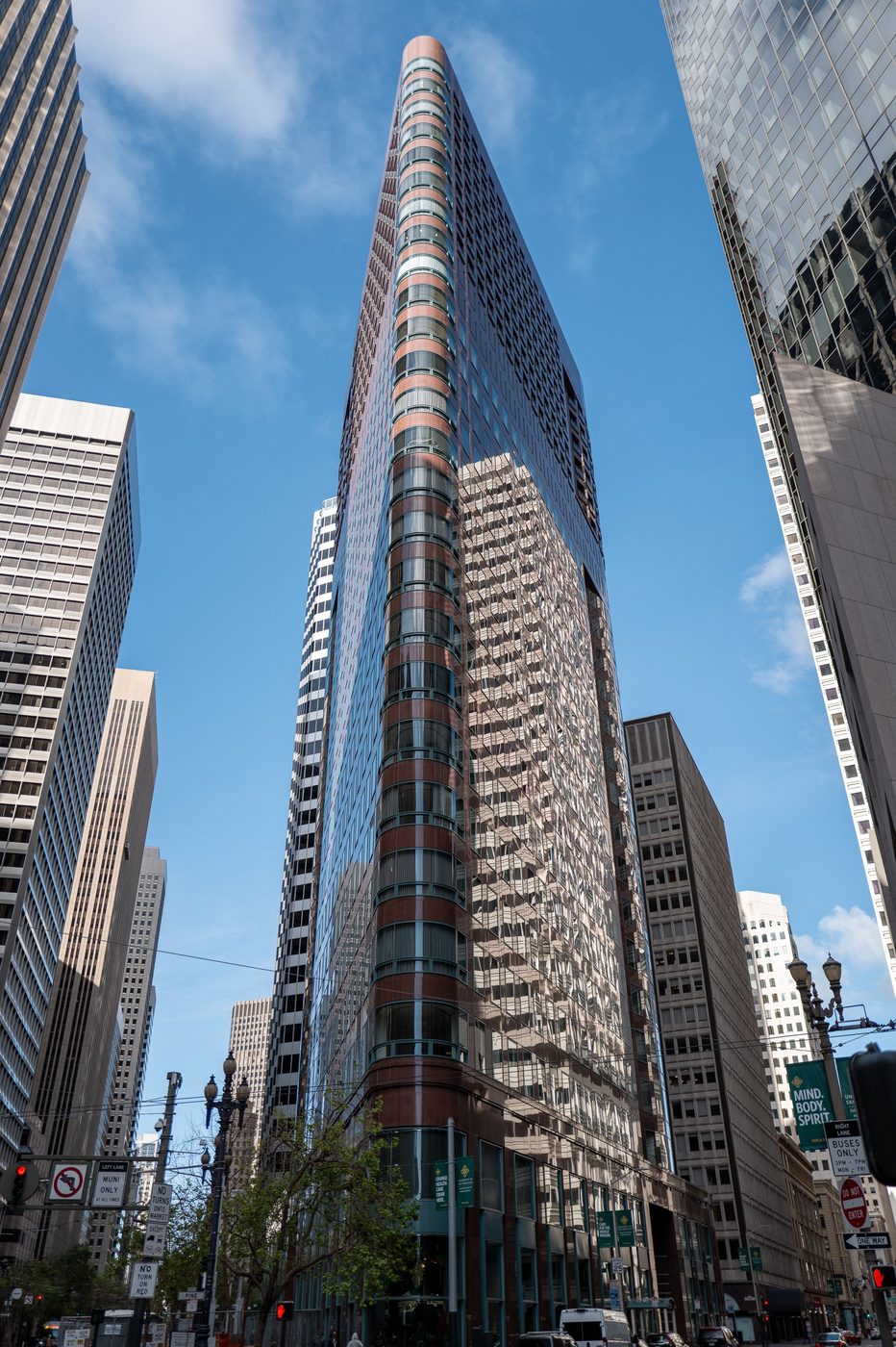 Salesforce Tower rising between the skyscrapers of the financial district, low-angle view, San Francisco