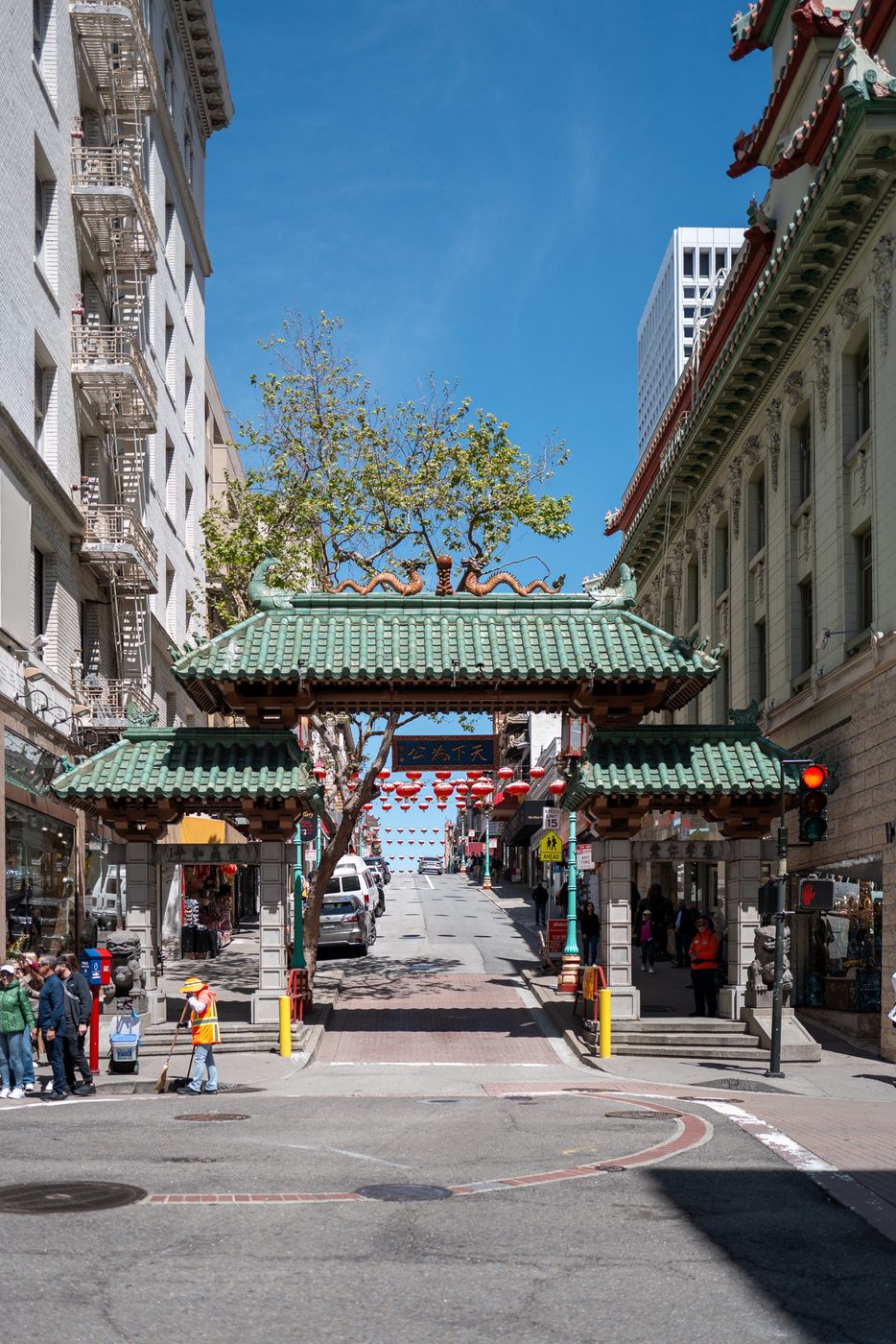 Chinatown Dragon Gate adorned with red lanterns, street below, San Francisco