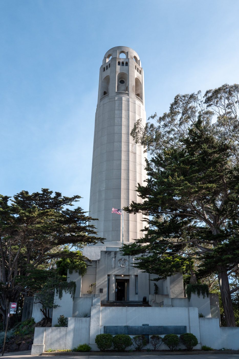 Coit Tower rising above the trees, low-angle view, San Francisco