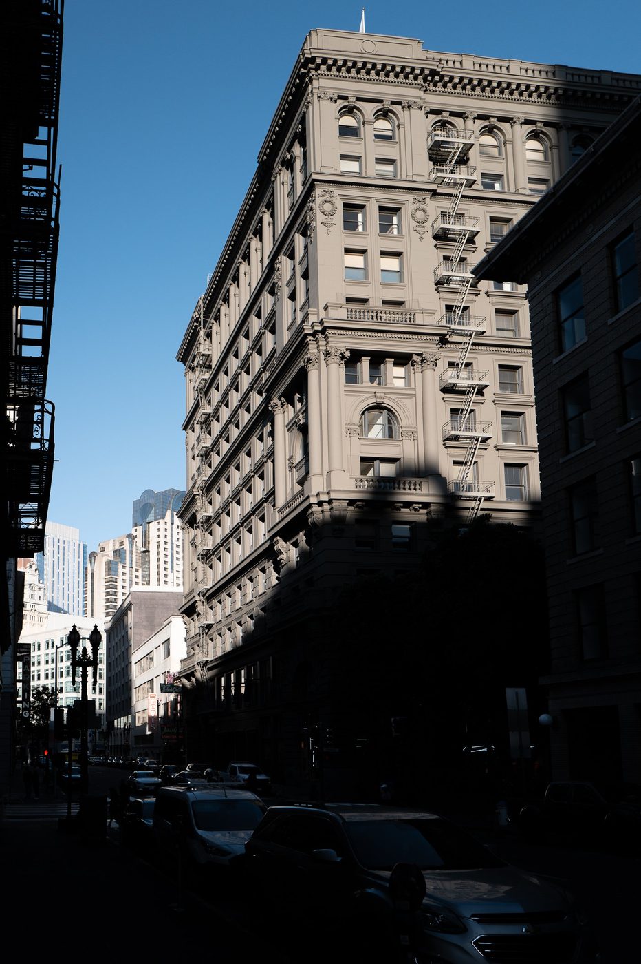 Silhouette of a classic colonnaded building outlined against a blue sky, San Francisco