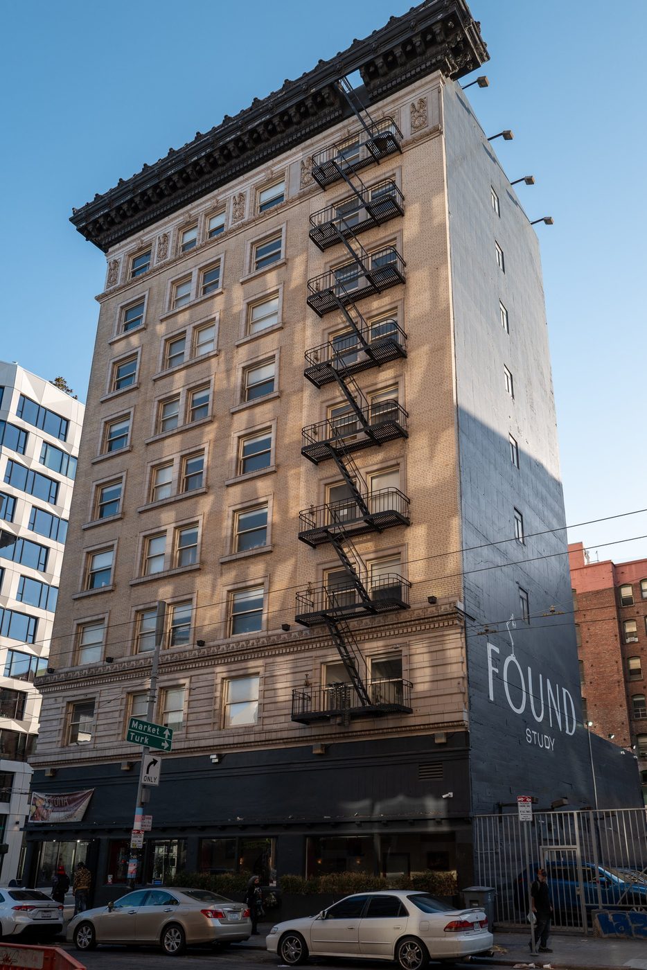 Found Study building at the corner of Market and Turk, fire escapes on the façade, San Francisco