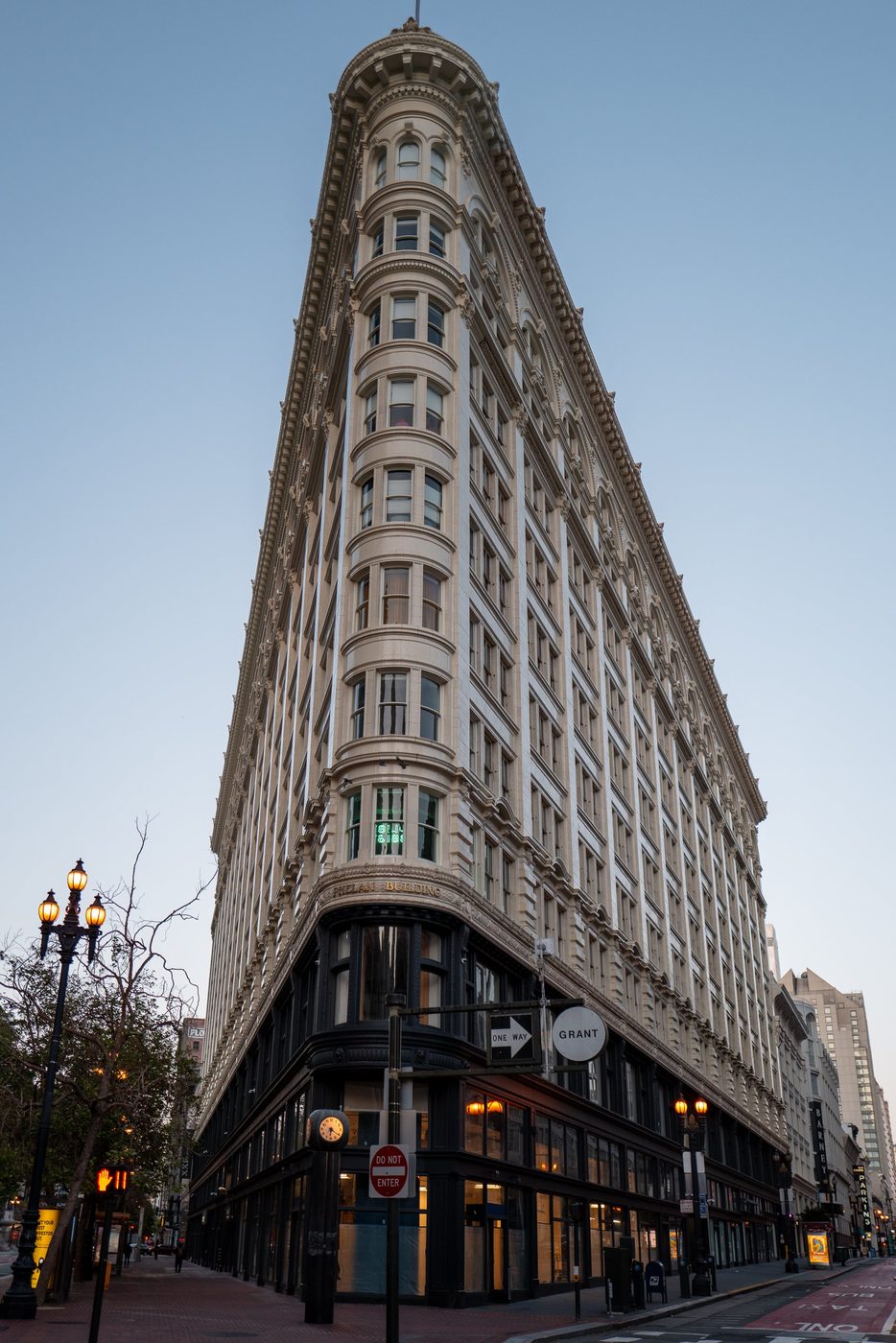 Phelan Building shaped like a ship's prow, classic façade at dusk, San Francisco
