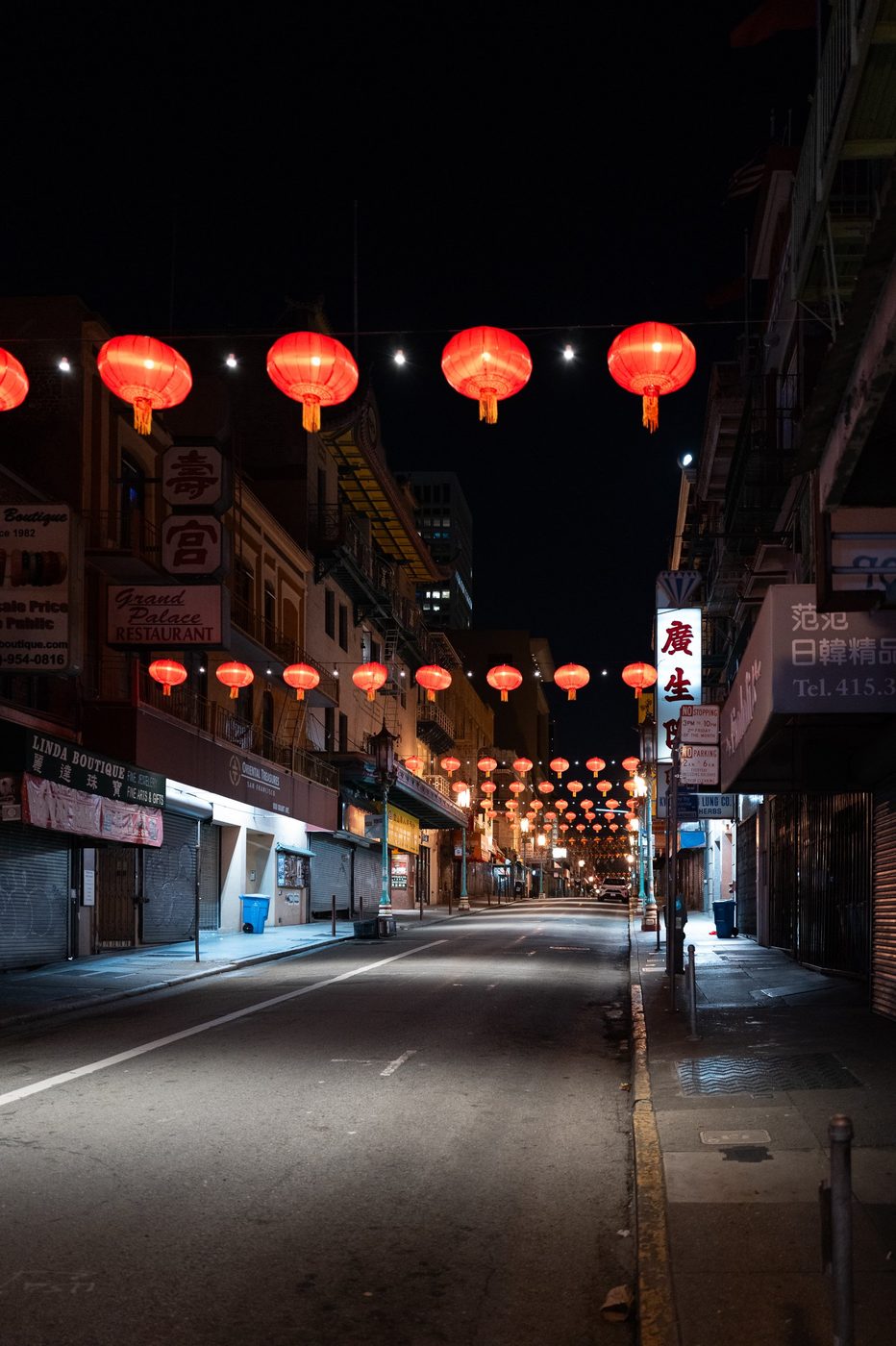 Red lanterns hanging over a deserted Chinatown street at night, San Francisco