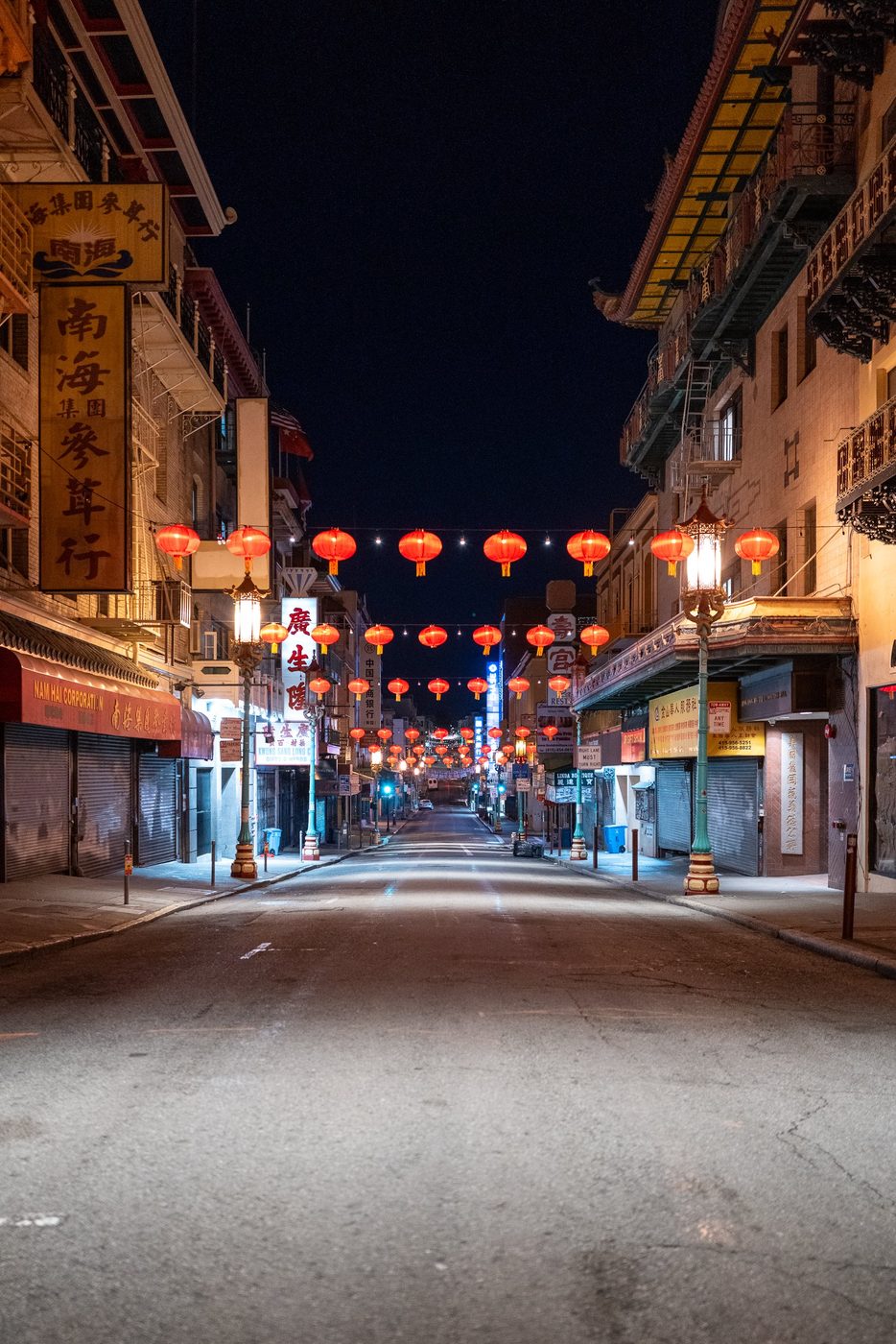 Garlands of red lanterns framing a Chinatown street at night, San Francisco
