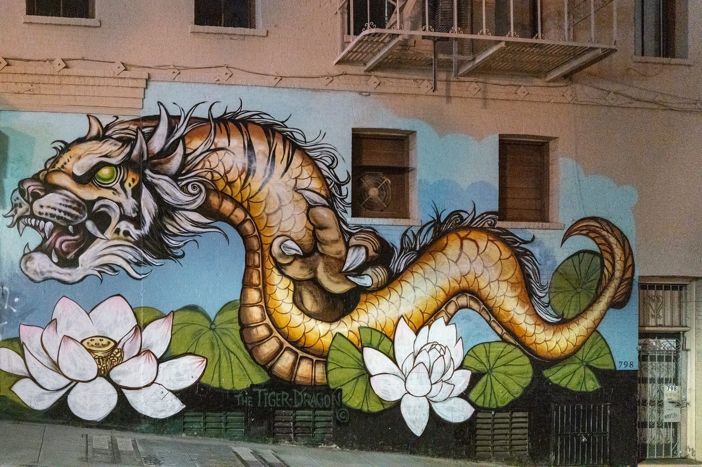 Mural of a striped dragon surrounded by lotus flowers, San Francisco