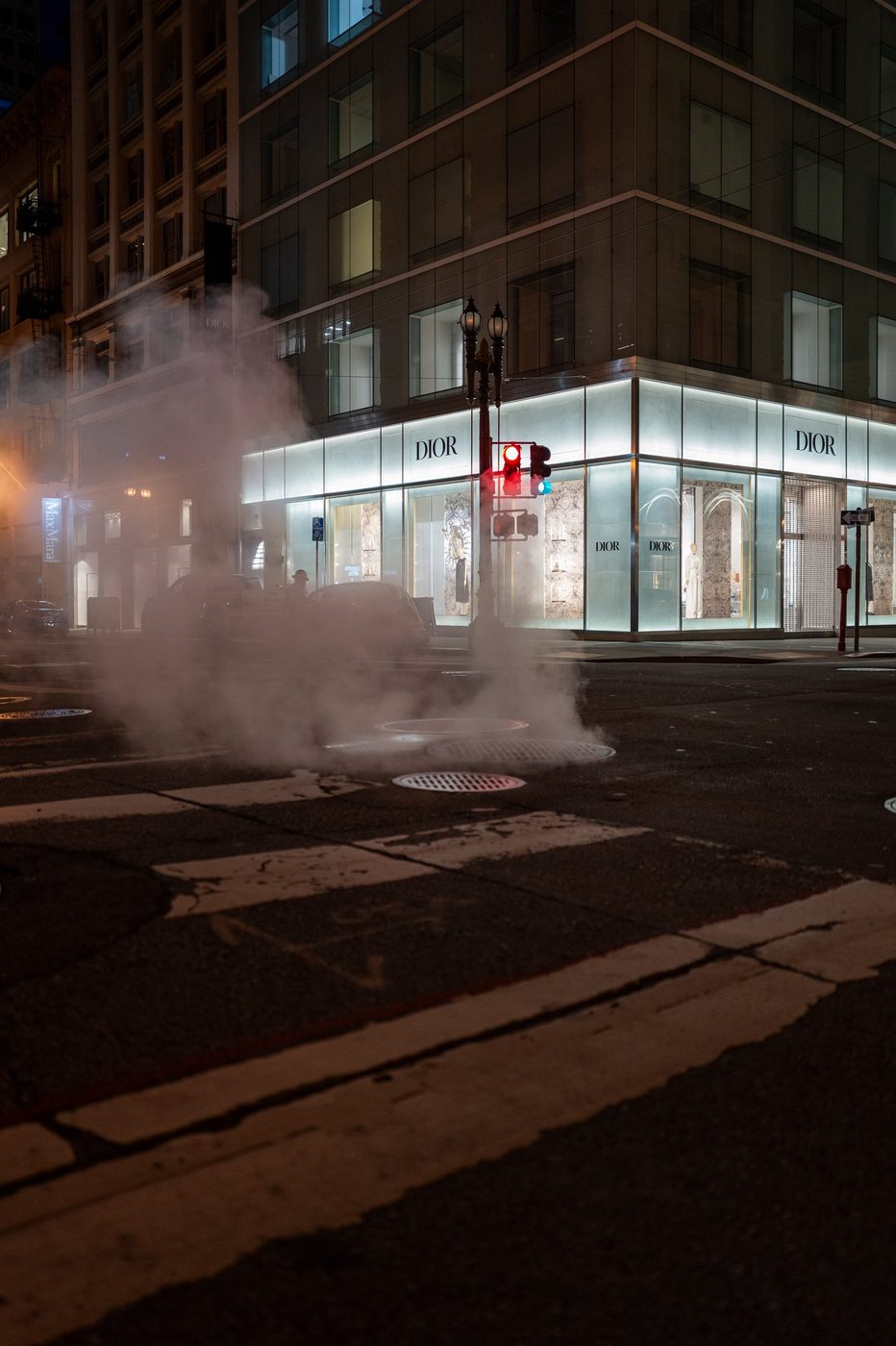 Night steam in front of the illuminated Dior boutique window, San Francisco