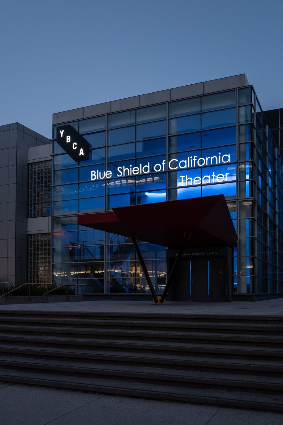 Glazed façade of the Blue Shield of California theater, red awning at the entrance, San Francisco