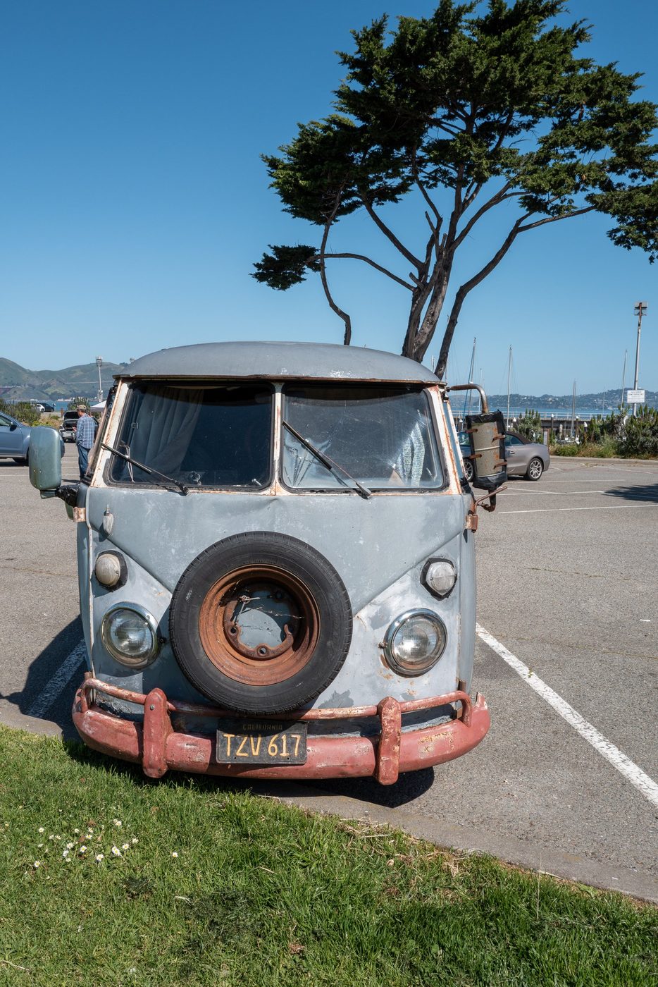 Weathered vintage Volkswagen camper van with its spare wheel on the front, San Francisco