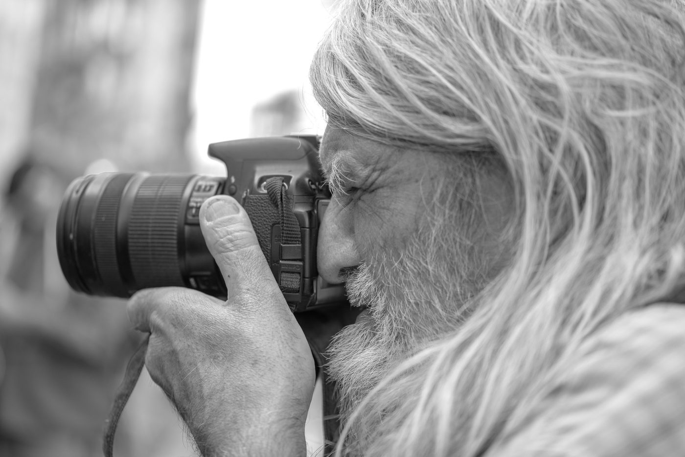 Photographer in action at the Zinneke Parade, Brussels (plate 001)