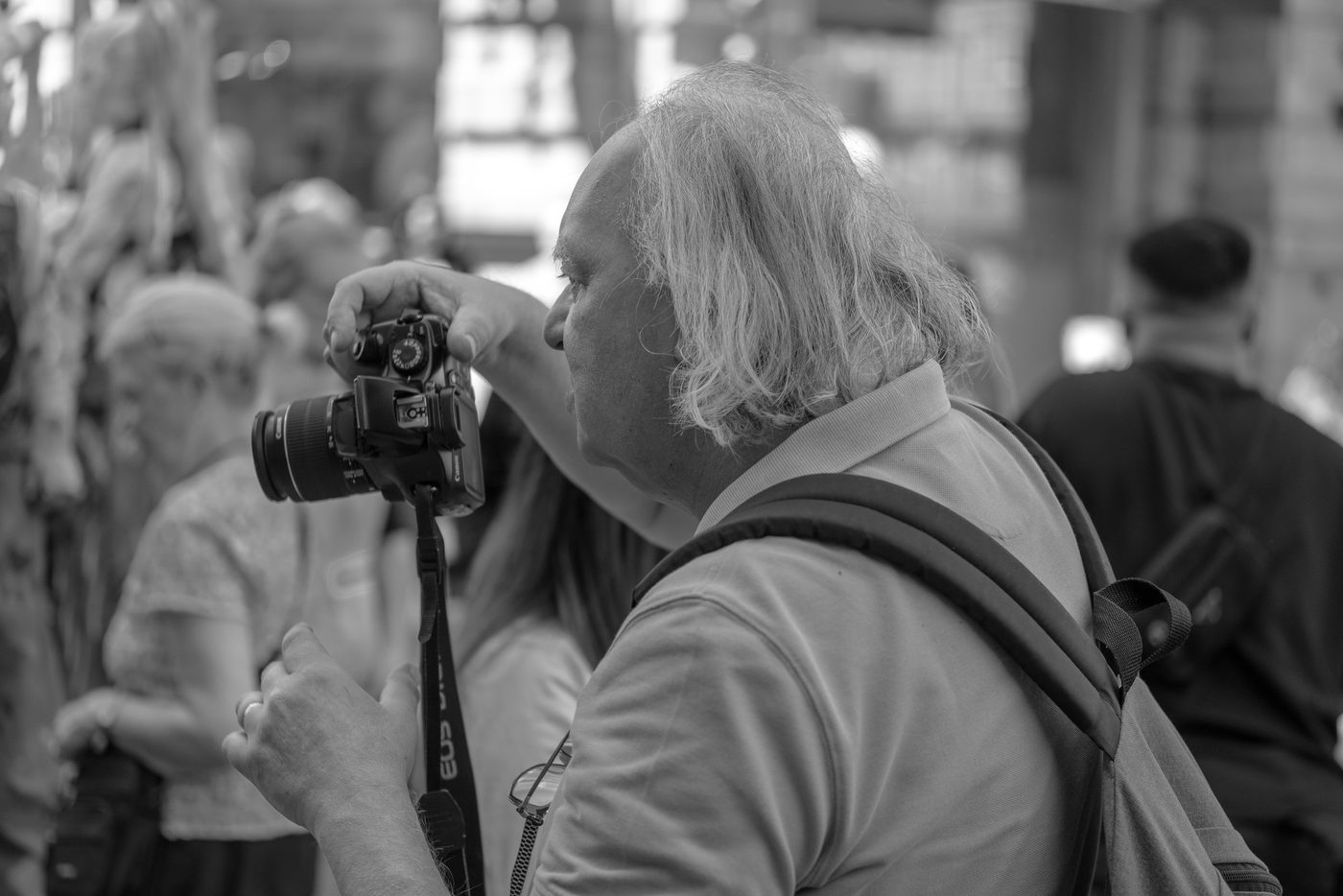 Photographer in action at the Zinneke Parade, Brussels (plate 002)