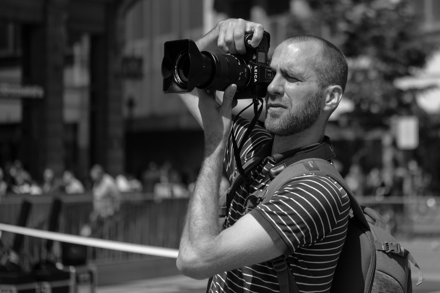 Photographer in action at the Zinneke Parade, Brussels (plate 004)