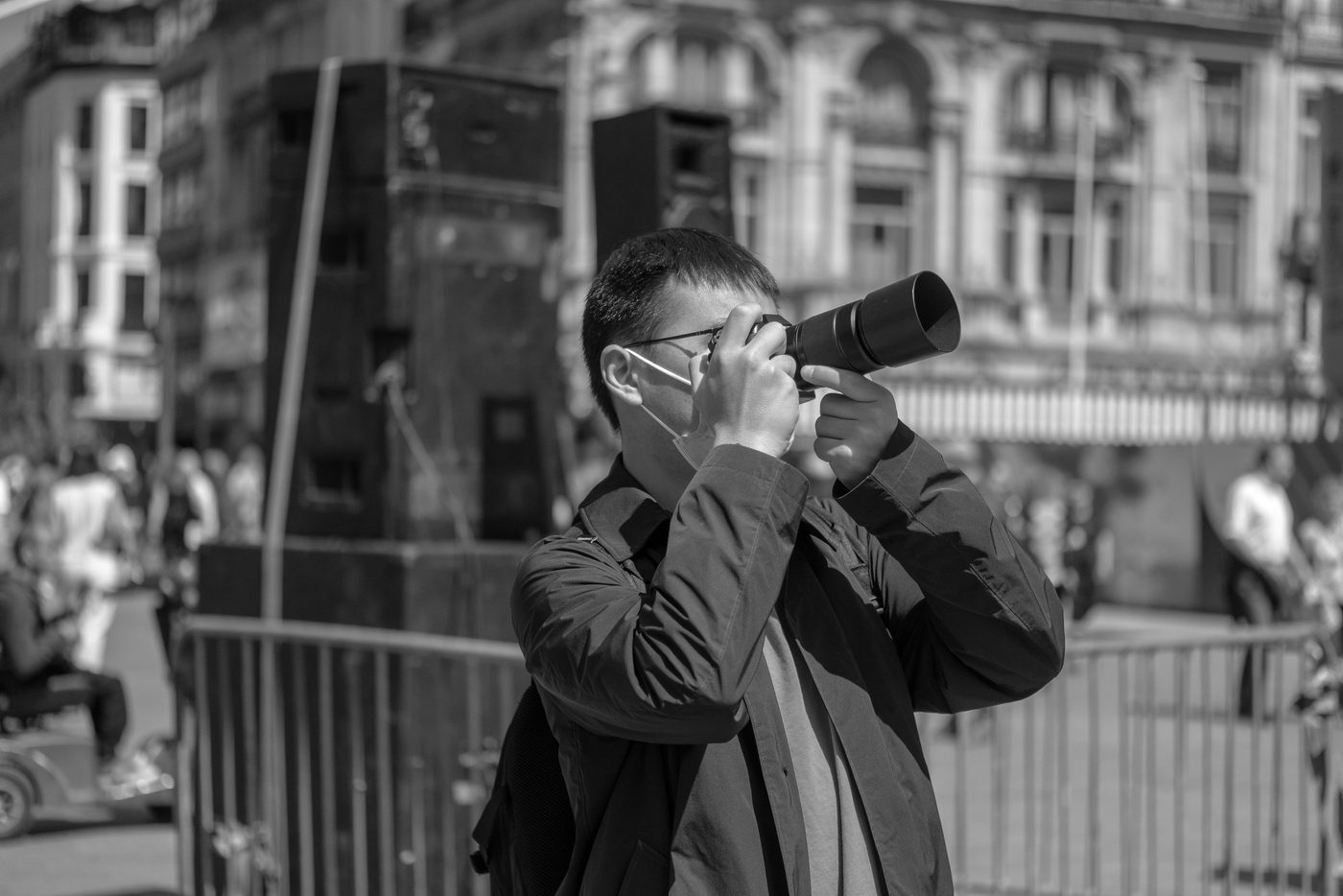 Photographer in action at the Zinneke Parade, Brussels (plate 005)