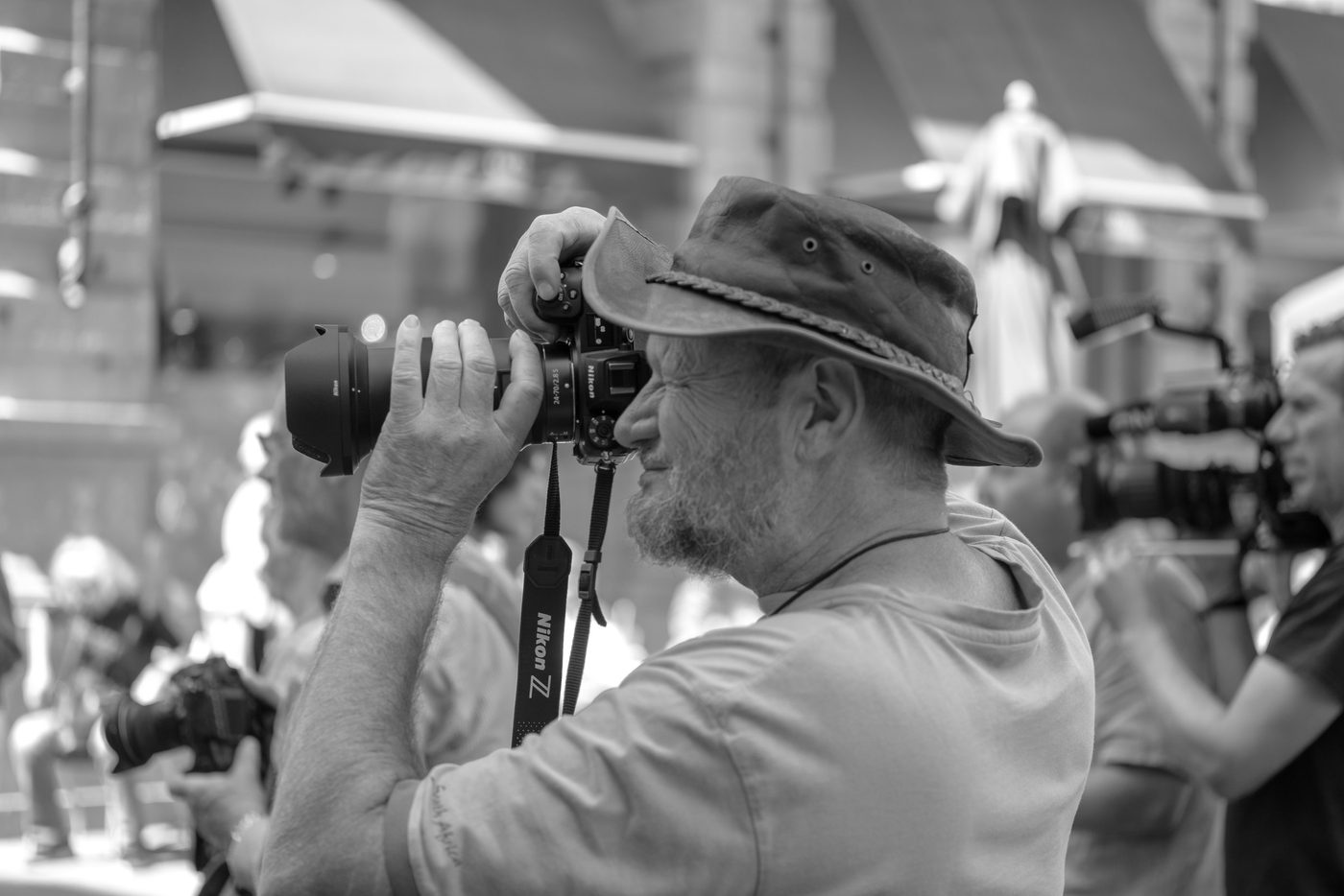 Photographer in action at the Zinneke Parade, Brussels (plate 007)