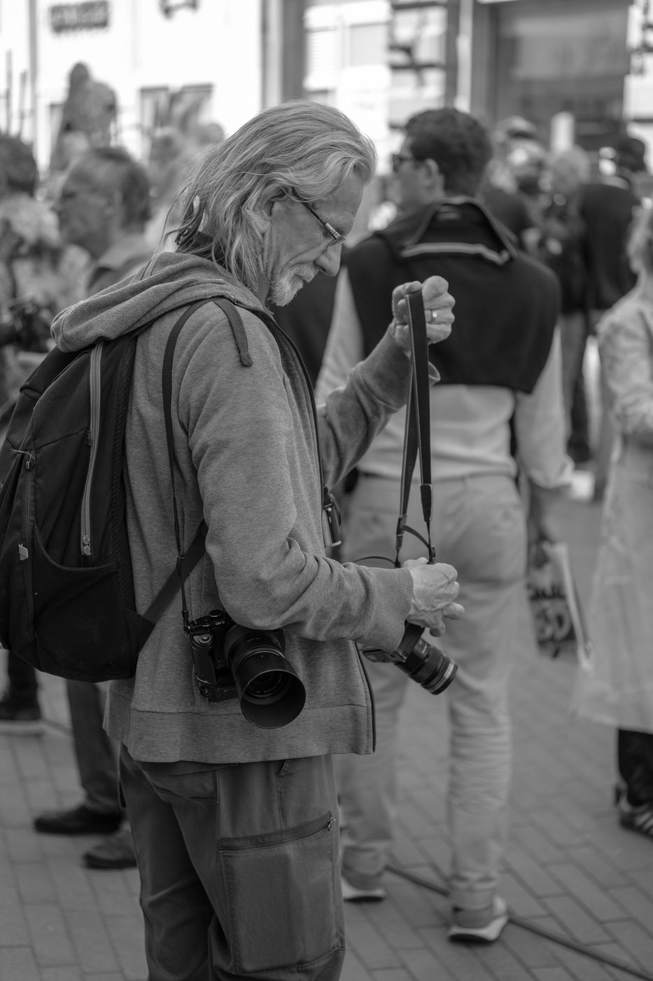 Photographer in action at the Zinneke Parade, Brussels (plate 008)