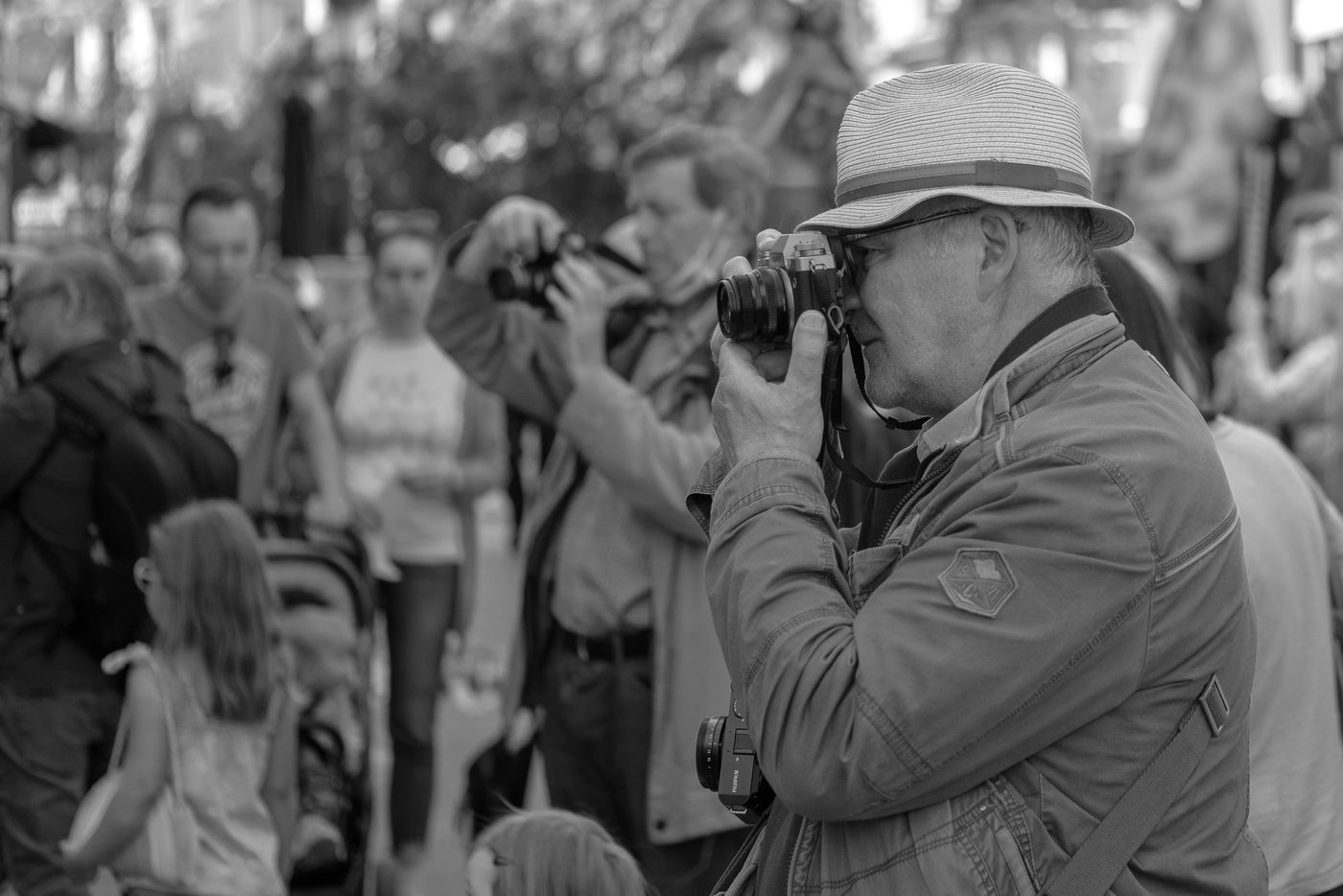 Photographer in action at the Zinneke Parade, Brussels (plate 010)