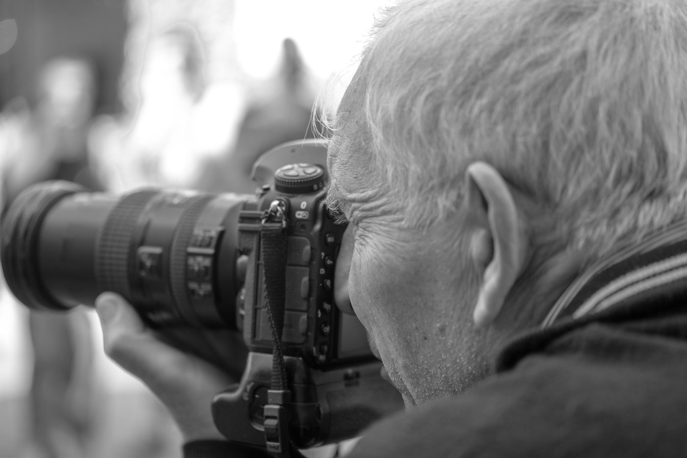 Photographer in action at the Zinneke Parade, Brussels (plate 016)