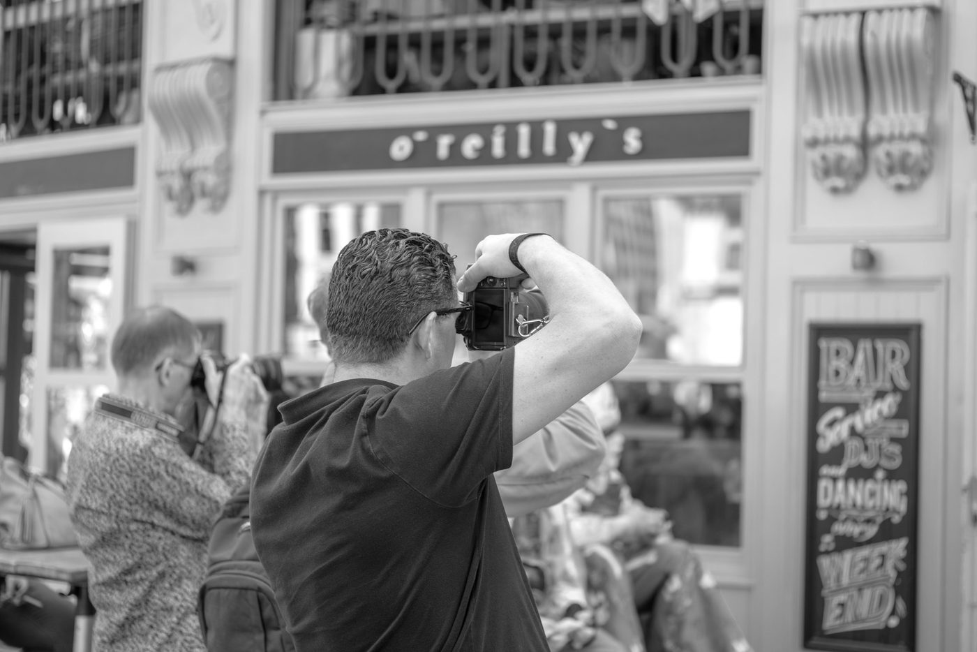 Photographer in action at the Zinneke Parade, Brussels (plate 024)